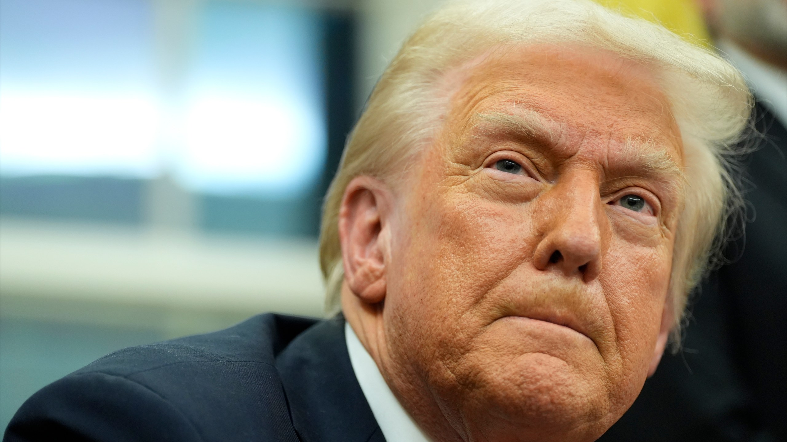 President Donald Trump listens to a question from a reporter as he signs executive orders in the Oval Office at the White House, Monday, Feb. 10, 2025, in Washington. (Photo/Alex Brandon)