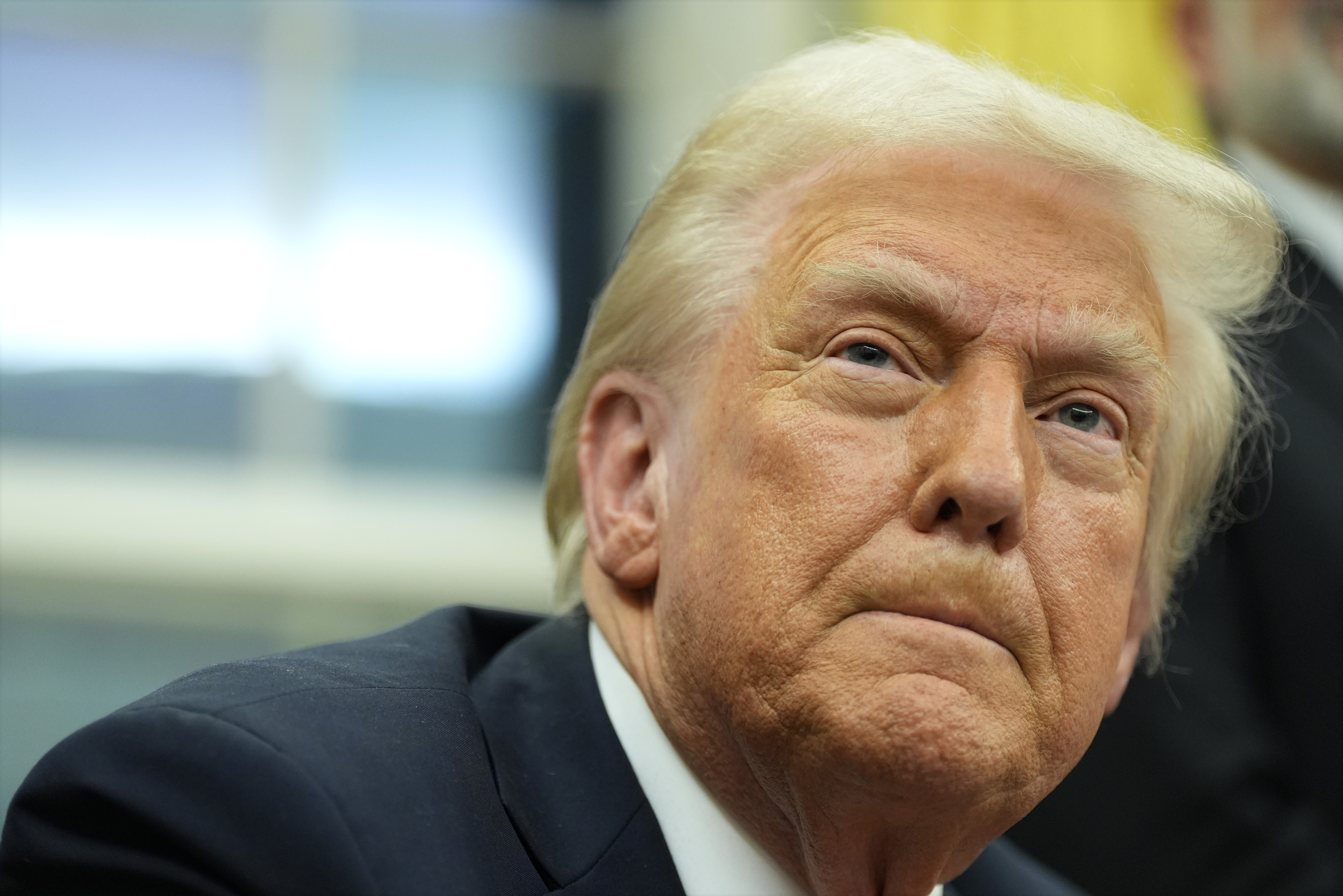 President Donald Trump listens to a question from a reporter as he signs executive orders in the Oval Office at the White House, Monday, Feb. 10, 2025, in Washington. (Photo/Alex Brandon)