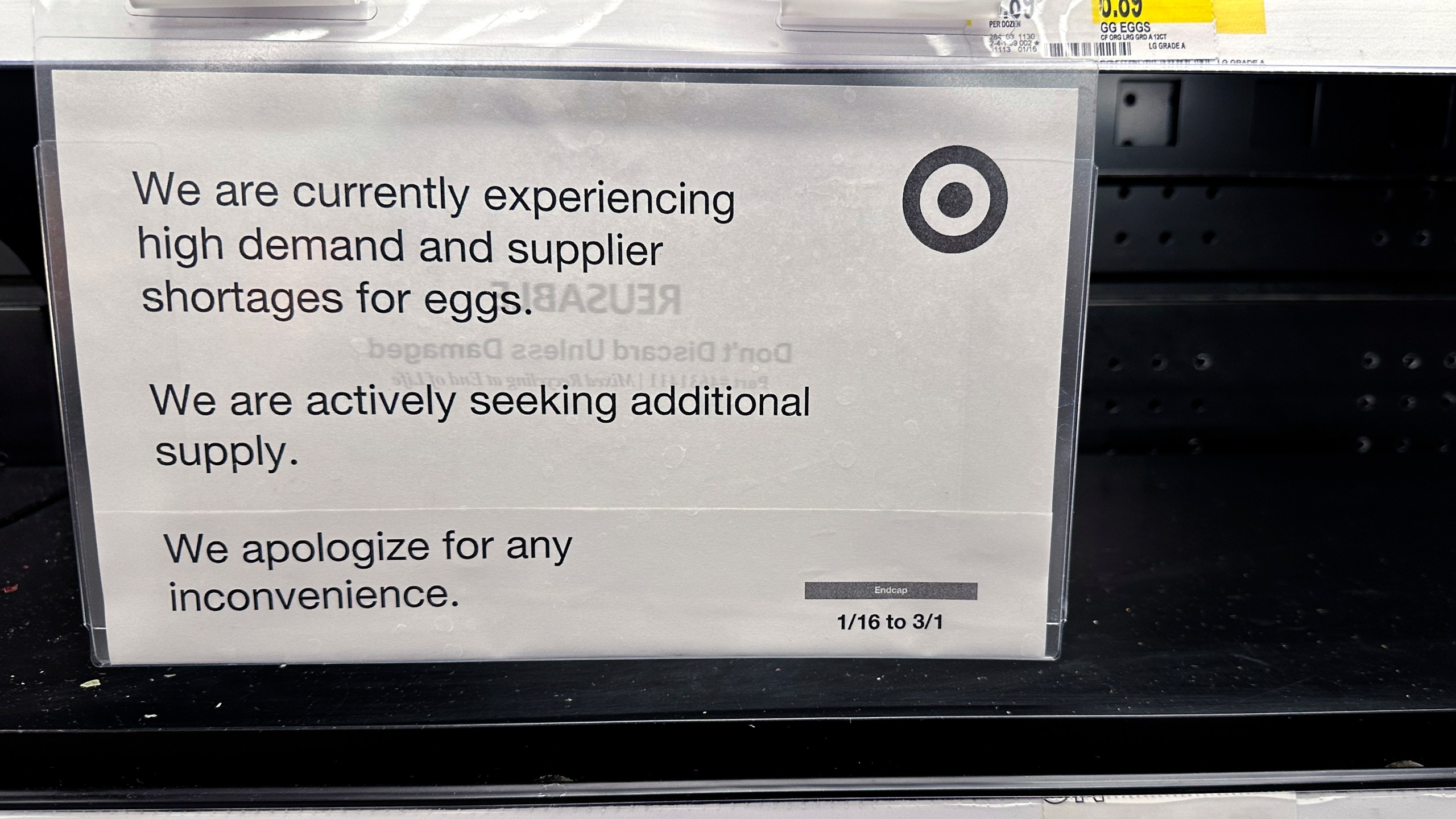 A sign is mounted on a shelve of eggs at a grocery store in Chicago, Saturday, Feb. 8, 2025. (AP Photo/Nam Y. Huh)