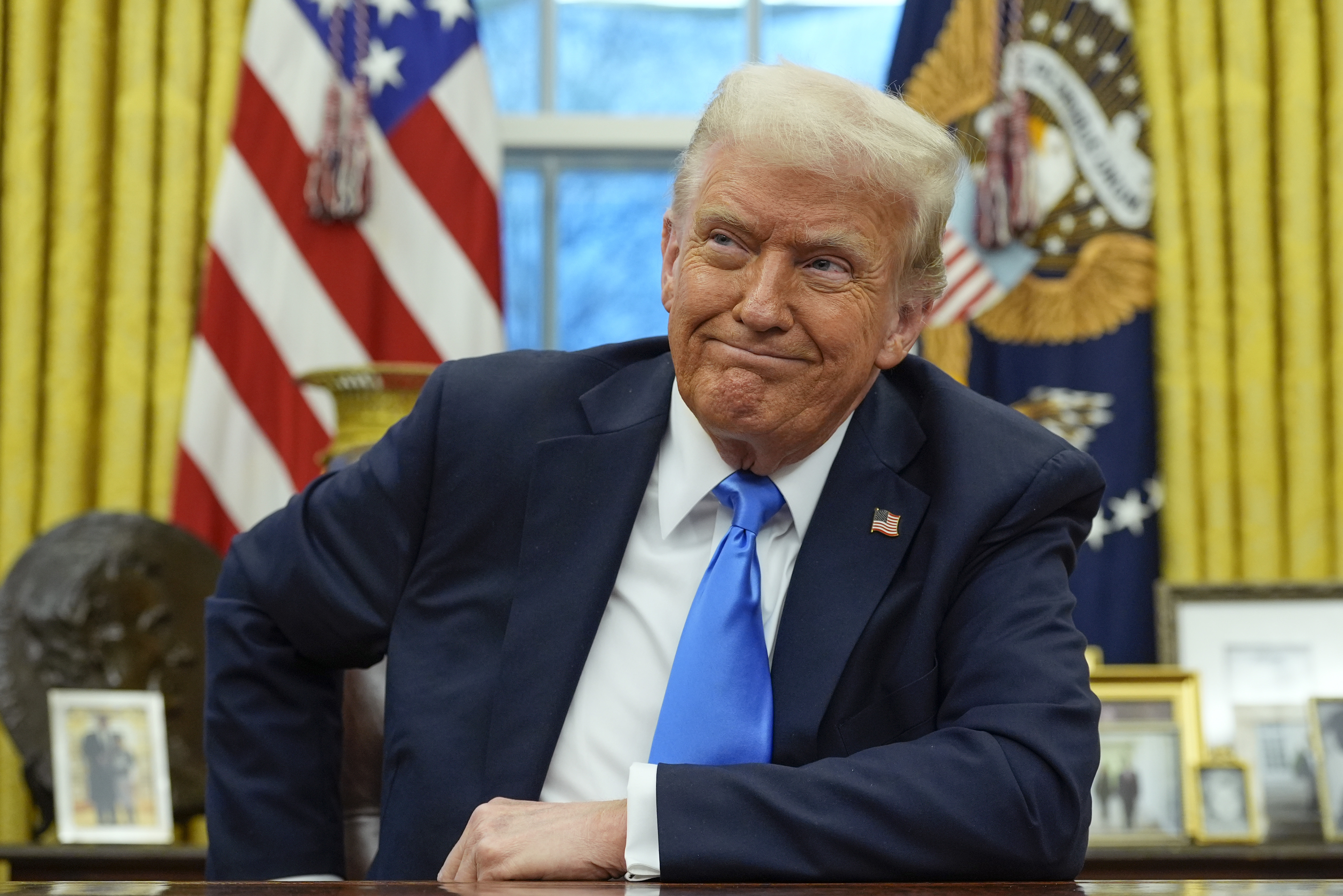 President Donald Trump speaks with reporters in the Oval Office at the White House, Tuesday, Feb. 11, 2025, in Washington. (Photo/Alex Brandon)