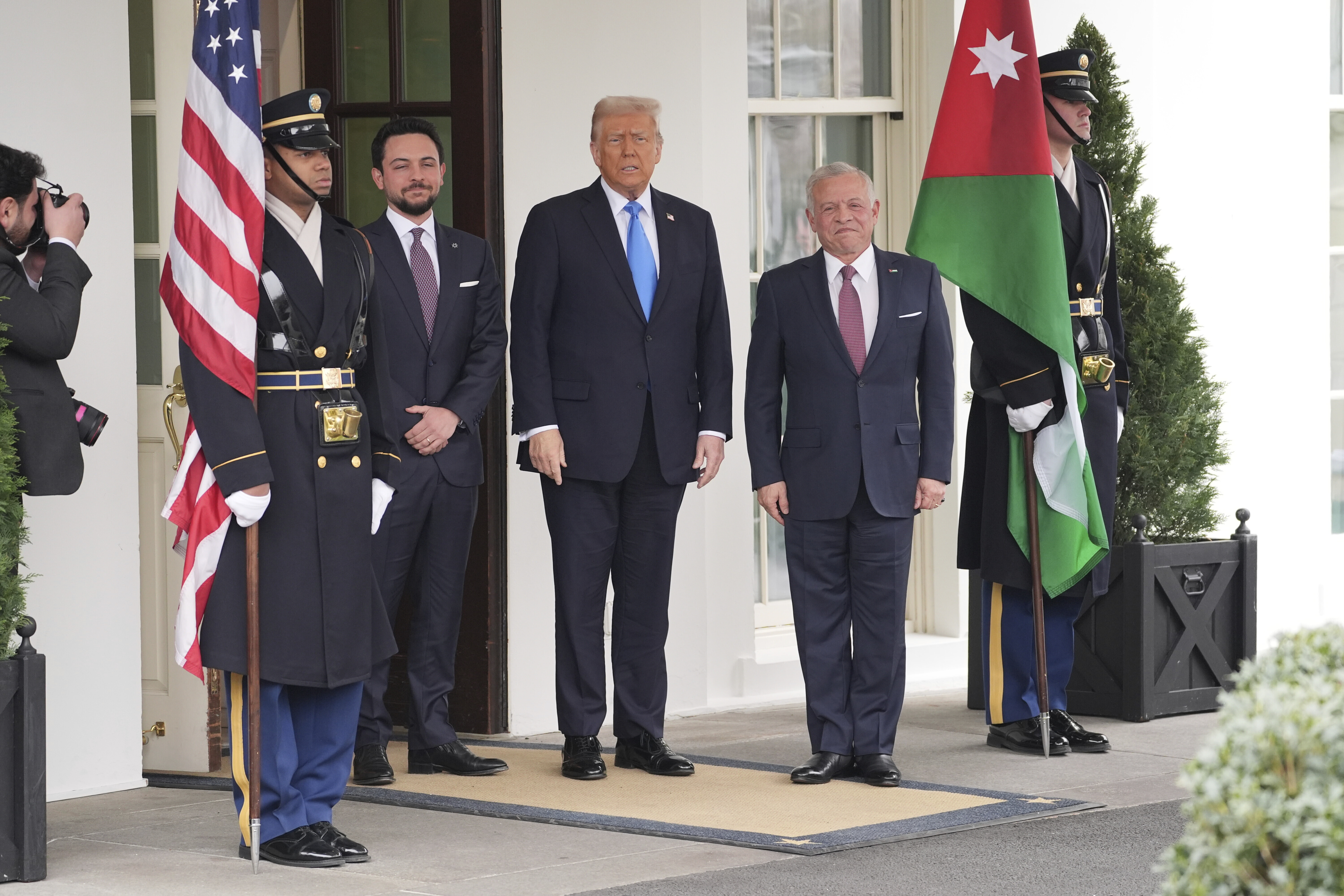 President Donald Trump greets Jordan's King Abdullah II, right, and Crown Prince Hussein at the White House, Tuesday, Feb. 11, 2025, in Washington. (AP Photo/Evan Vucci)