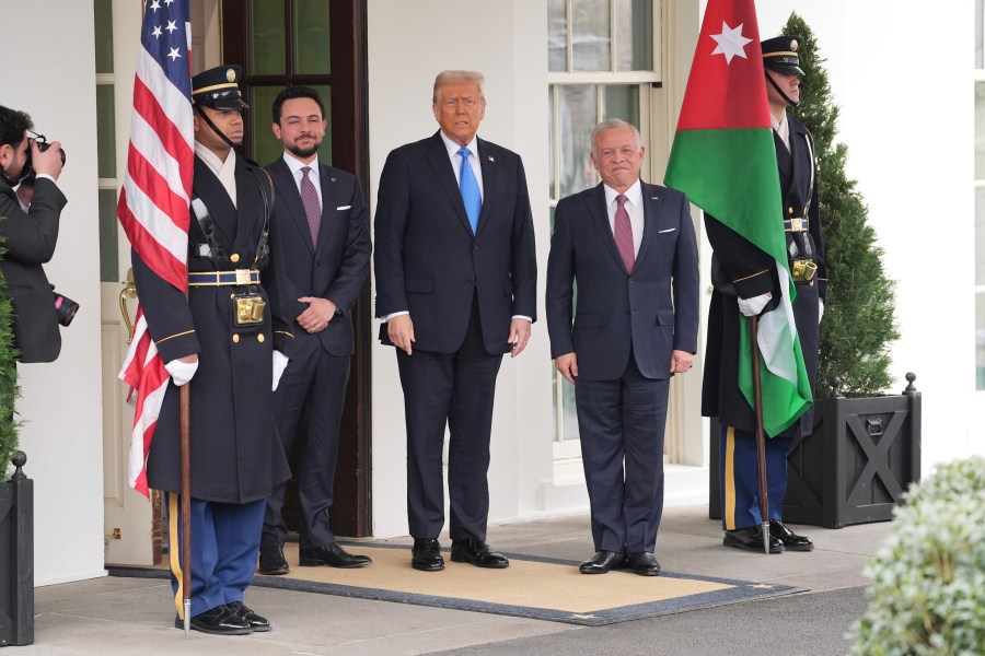 President Donald Trump greets Jordan's King Abdullah II, right, and Crown Prince Hussein at the White House, Tuesday, Feb. 11, 2025, in Washington. (AP Photo/Evan Vucci)