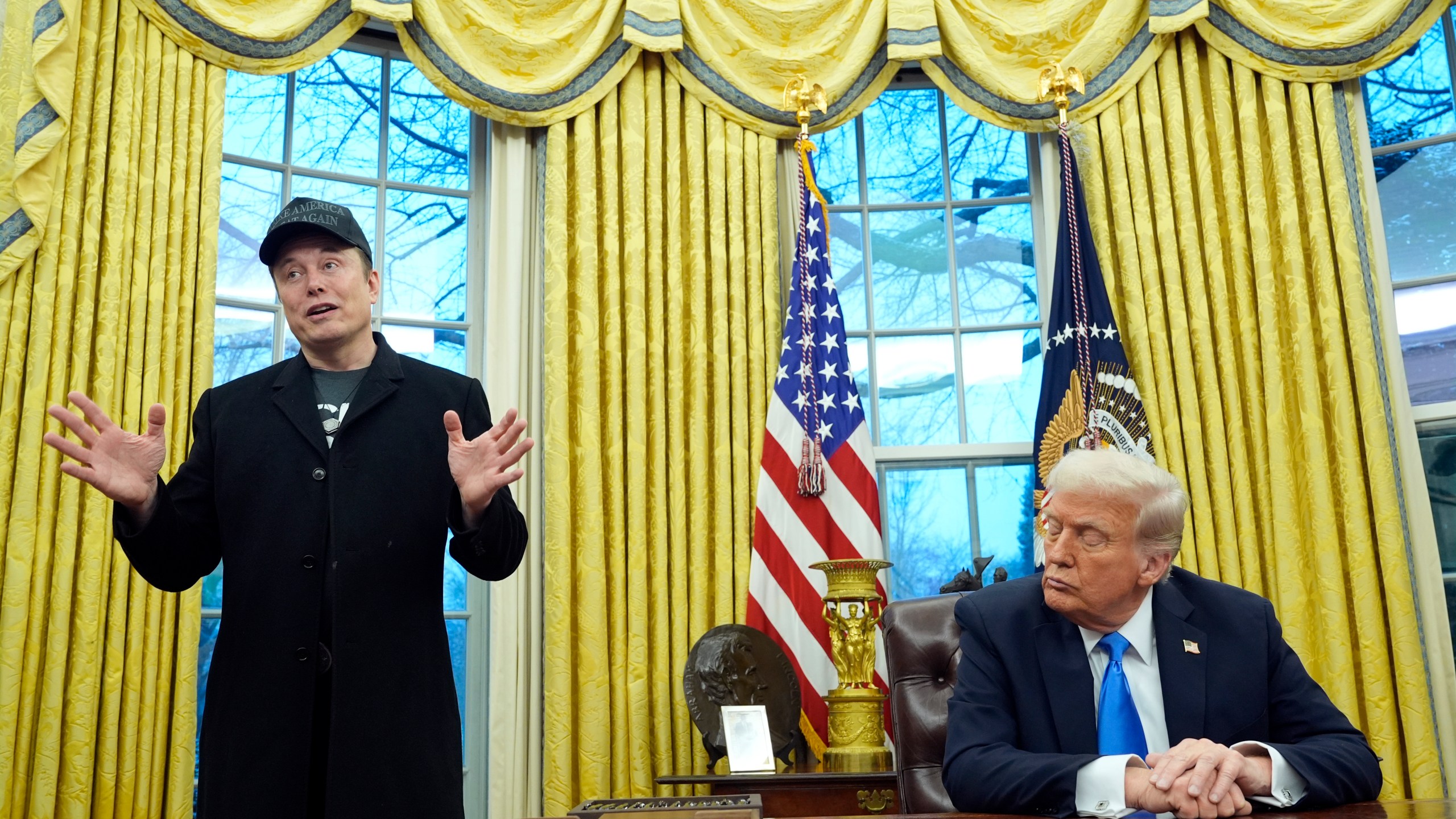 President Donald Trump listens as Elon Musk speaks in the Oval Office at the White House, Tuesday, Feb. 11, 2025, in Washington. (Photo/Alex Brandon)