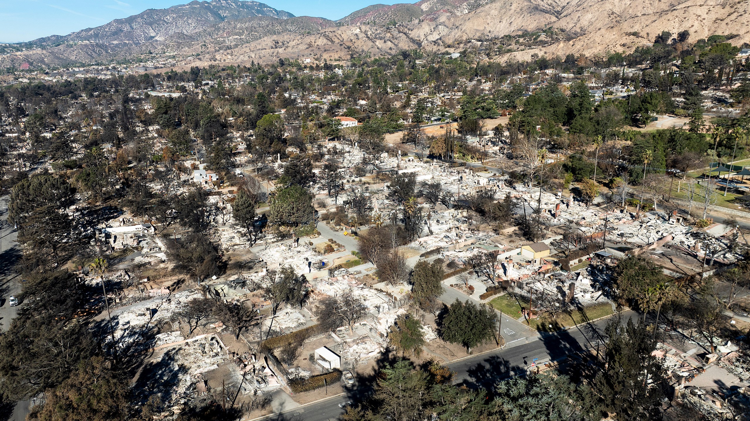 FILE - Residences destroyed by the Eaton Fire line a neighborhood in Altadena, Calif., on Tuesday, Jan. 21, 2025. (AP Photo/Noah Berger, File)