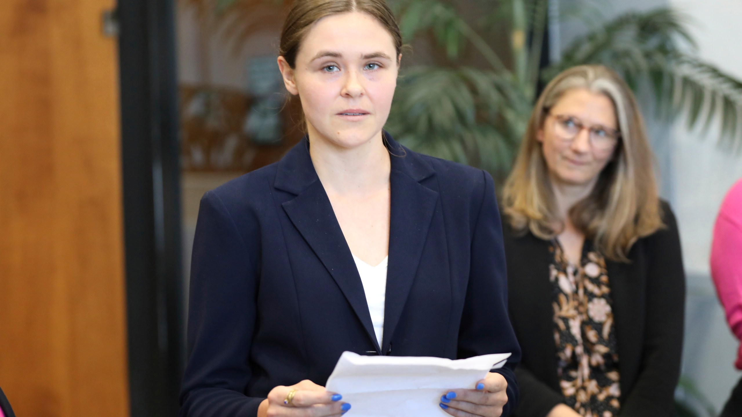 FILE - Taylor Shelton, who sued South Carolina over the definition of "heartbeat" under the state's 2023 abortion law, reads a statement after her case was argued in court on Thursday, May 2, 2024, in Columbia, S.C. (AP Photo/Jeffrey Collins, File)