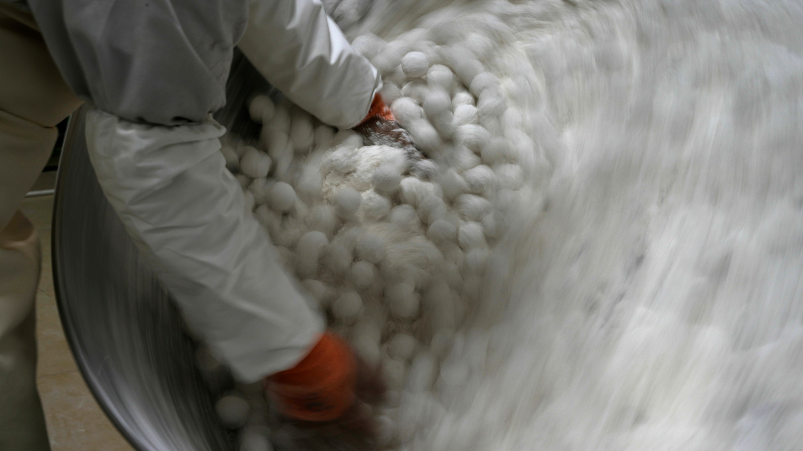 A worker at the Jinfang Snacks Shop makes yuanxiao, a traditional Chinese food made with glutinous rice flour and sweet fillings consumed as part of the upcoming Lantern Festival celebrations in Beijing, Tuesday, Feb. 11, 2025. (AP Photo/Ng Han Guan)