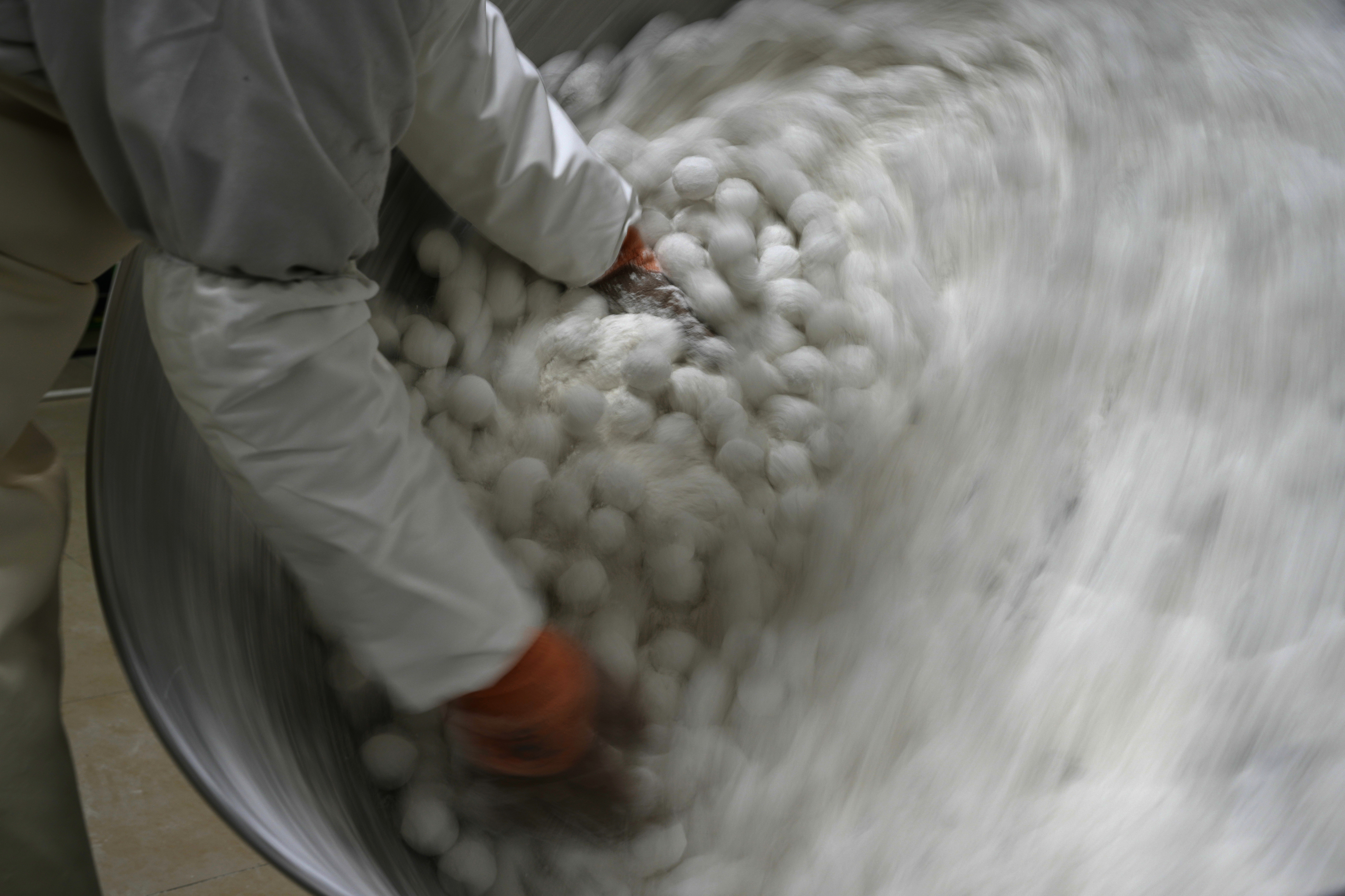 A worker at the Jinfang Snacks Shop makes yuanxiao, a traditional Chinese food made with glutinous rice flour and sweet fillings consumed as part of the upcoming Lantern Festival celebrations in Beijing, Tuesday, Feb. 11, 2025. (AP Photo/Ng Han Guan)