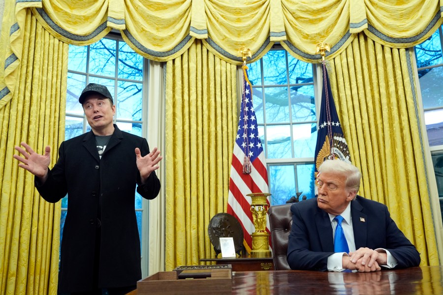 President Donald Trump listens as Elon Musk speaks in the Oval Office at the White House, Tuesday, Feb. 11, 2025, in Washington. (Photo/Alex Brandon)