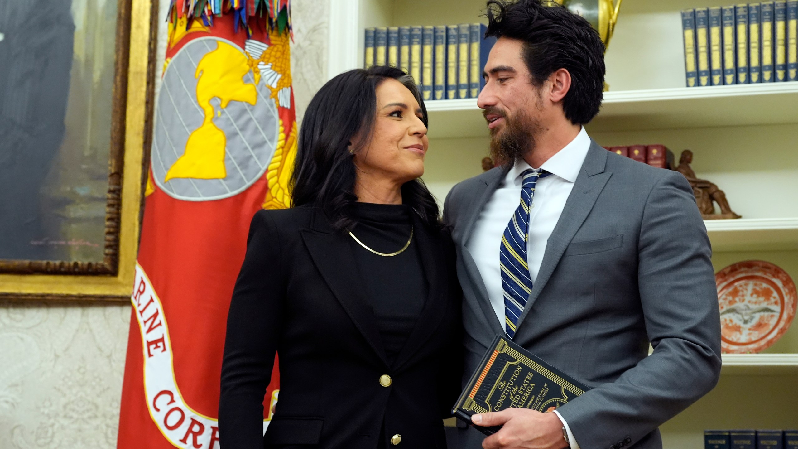 Tulsi Gabbard stands with her husband Abraham Williams before she is sworn in as the Director of National Intelligence in the Oval Office at the White House, Wednesday, Feb. 12, 2025, in Washington. (Photo/Alex Brandon)