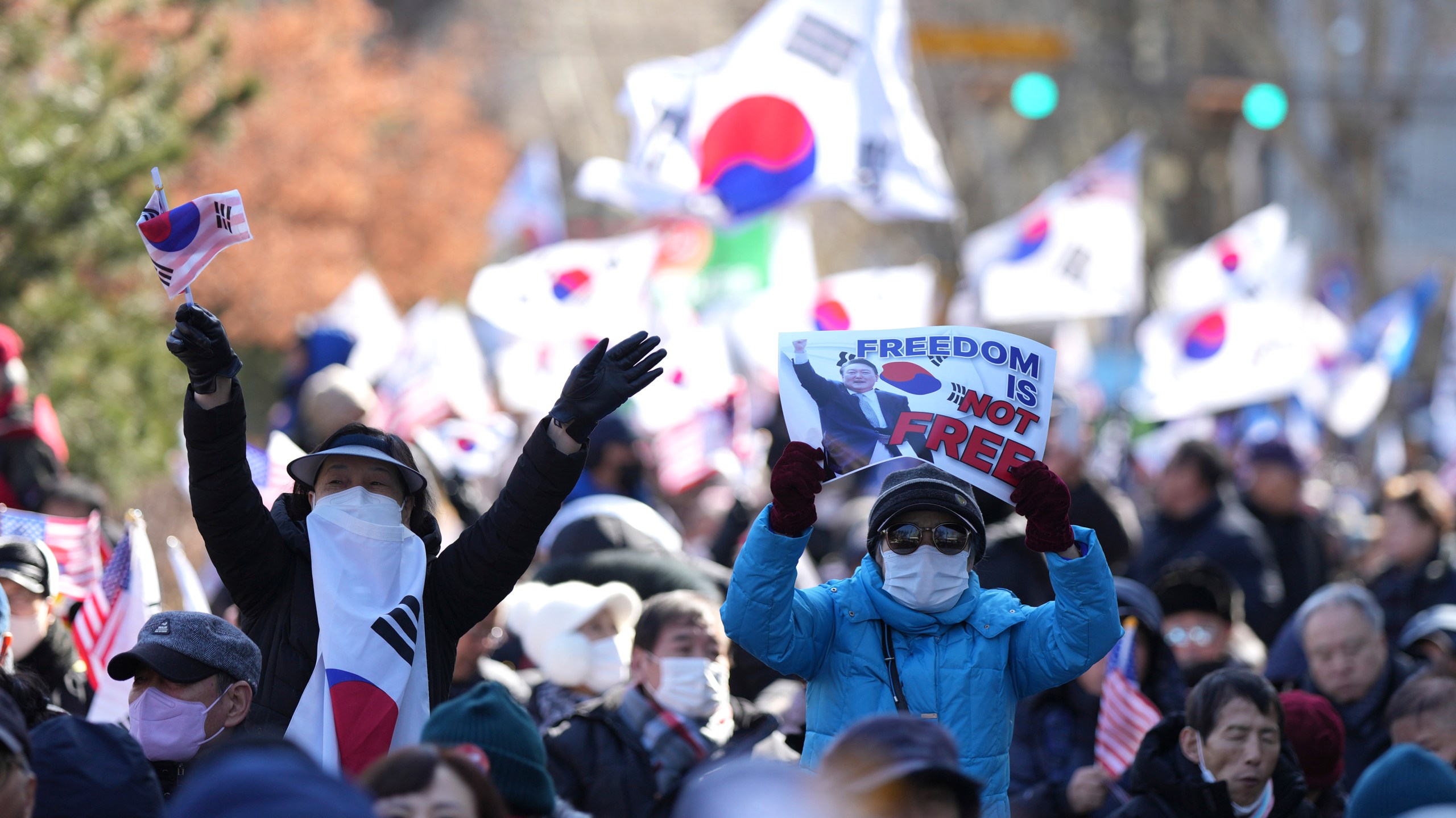 Supporters of impeached South Korean President Yoon Suk Yeol hold signs during a rally to oppose his impeachment near the Constitutional Court in Seoul, South Korea, Thursday, Feb. 13, 2025. (AP Photo/Lee Jin-man)