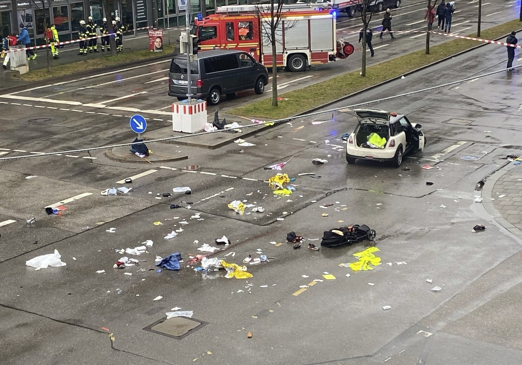 Emergency services attend the scene of an accident after a driver hit a group of people in Munich, Germany, Thursday Feb. 13, 2025. (Alexa Gr'f/dpa via AP)