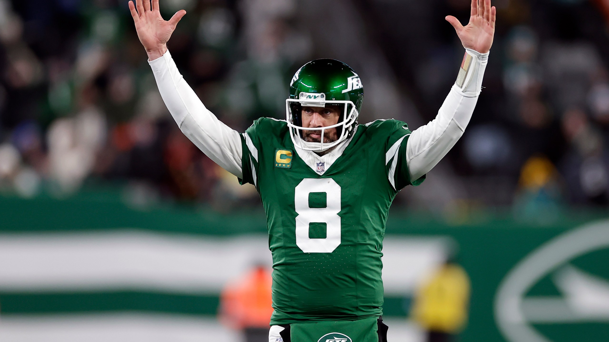 FILE - New York Jets quarterback Aaron Rodgers (8) reacts after a touchdown pass during an NFL football game against the Miami Dolphins Sunday, Jan. 5, 2025, in East Rutherford, N.J. (AP Photo/Adam Hunger, File)