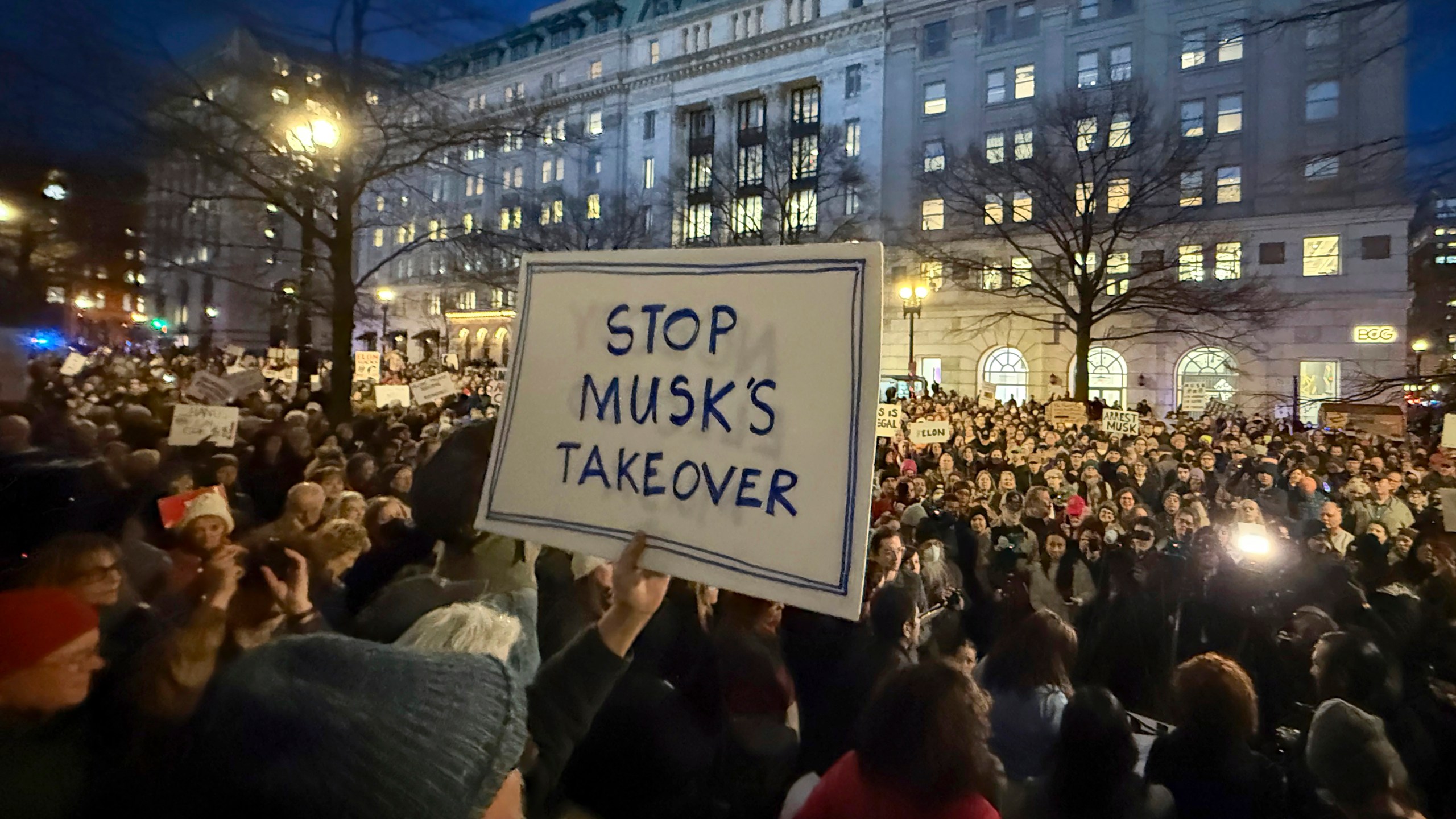 FILE - People protest during a rally outside the Treasury Department in Washington, Feb. 4, 2025. (AP Photo/Jose Luis Magana, File)