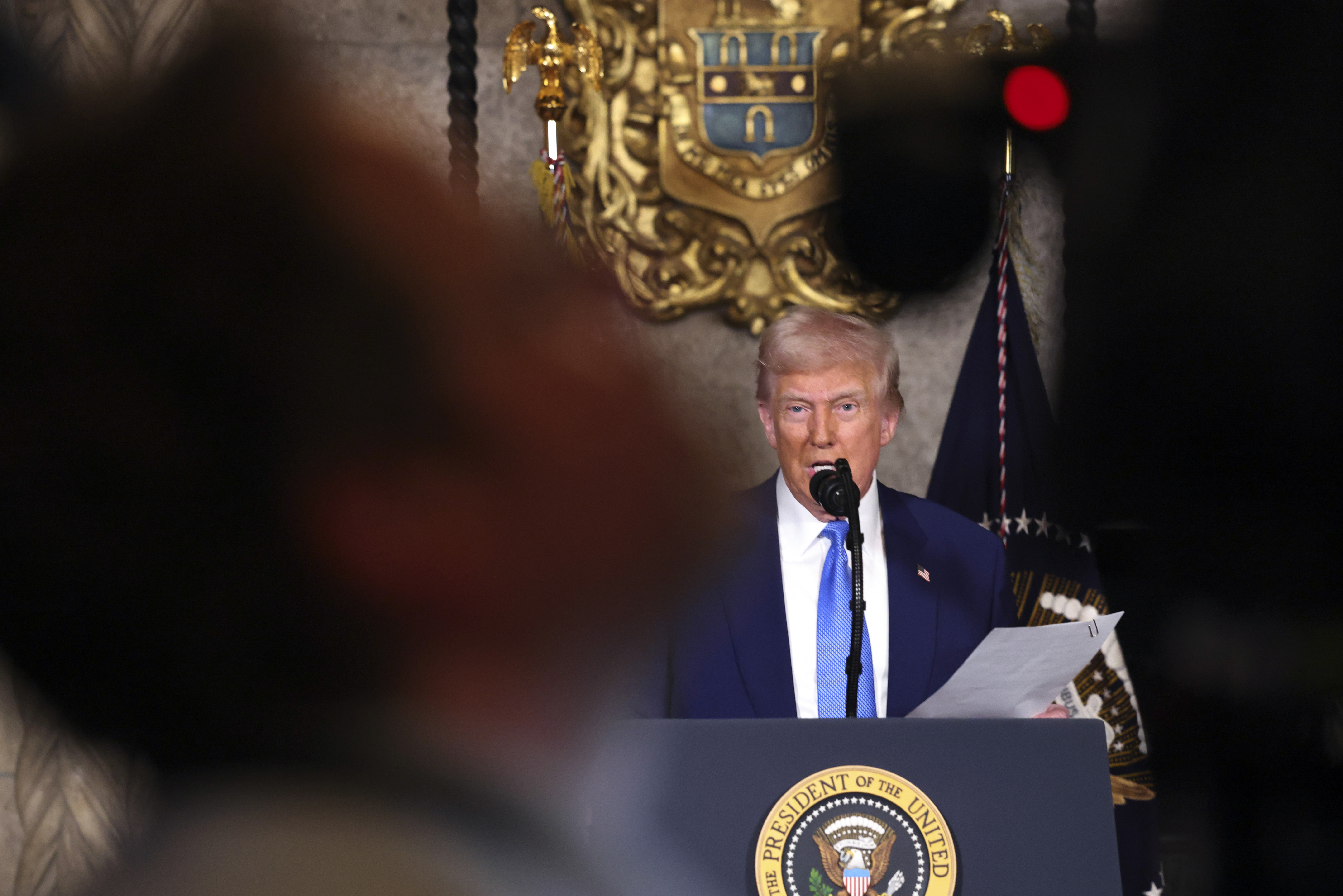 President Donald Trump speaks at Mar-a-Lago in Palm Beach, Fla., Tuesday, Feb. 18, 2025. (Pool via AP)