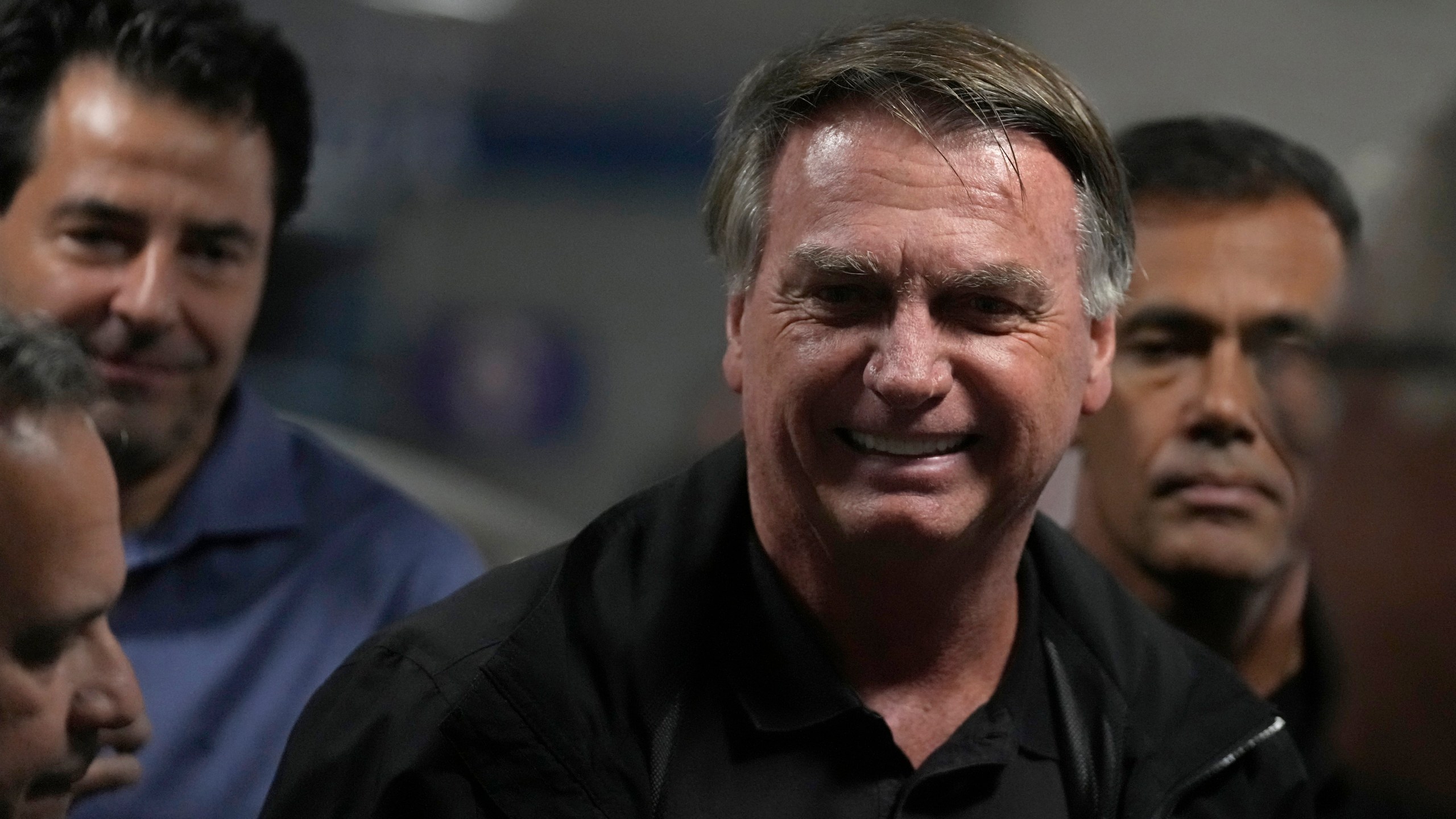 Former Brazilian President Jair Bolsonaro arrives for a luncheon with senators from his support base, at the National Congress building in Brasilia, Brazil, Tuesday, Feb. 18, 2025. (AP Photo/Eraldo Peres)