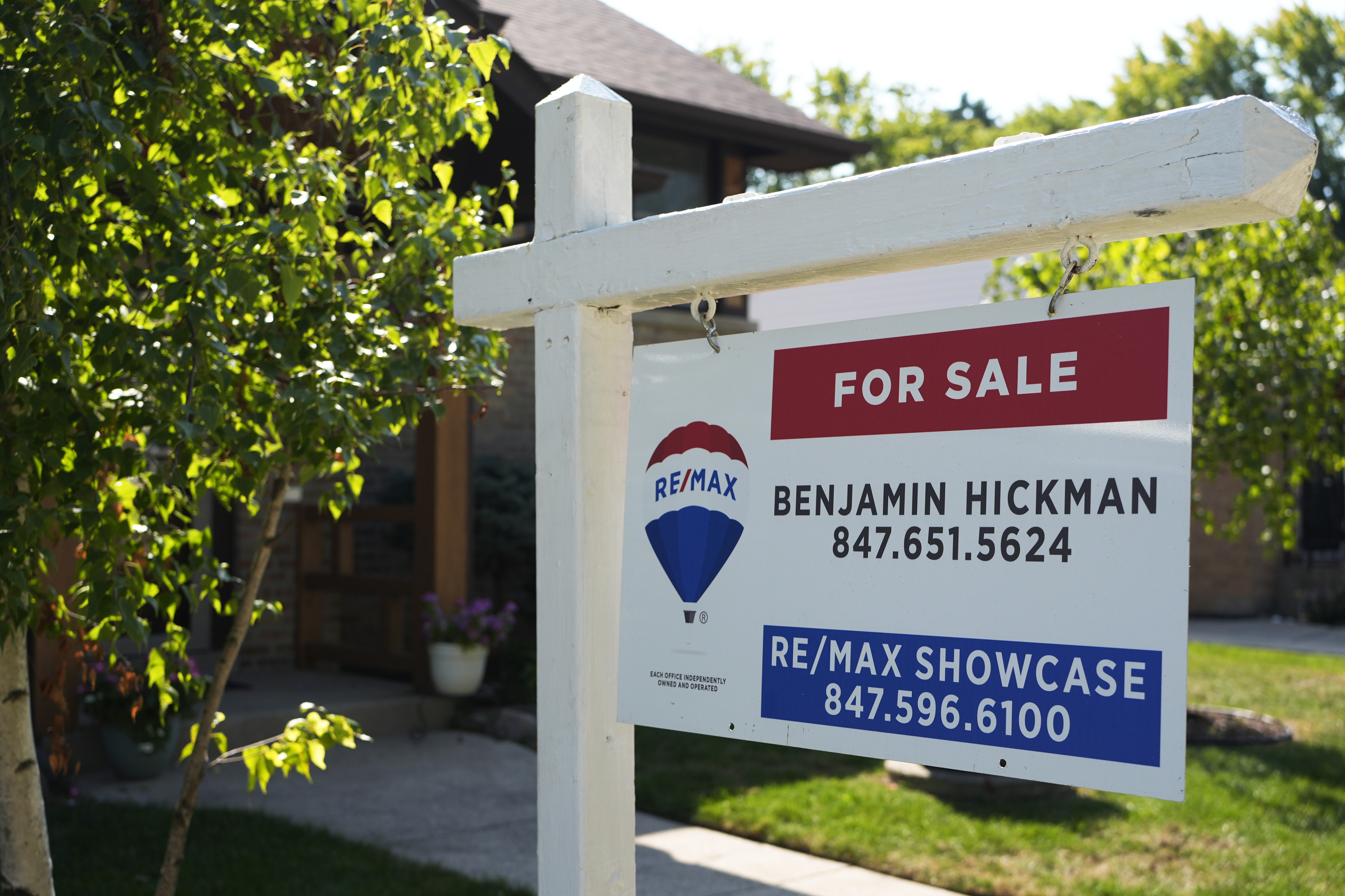 A "For Sale" sign is displayed in front of a home in Morton Grove, Ill., Sunday, Aug. 25, 2024. (AP Photo/Nam Y. Huh)