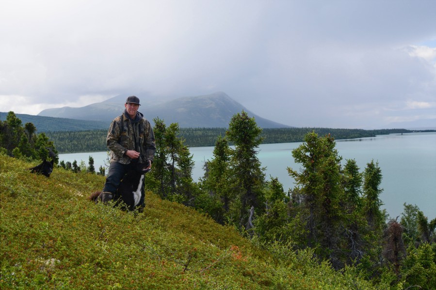 In this image provided by Beth Hill, Warren Hill poses for a photo at Lake Clark National Park and Preserve in Alaska July 15, 2018. (Beth Hill via AP)