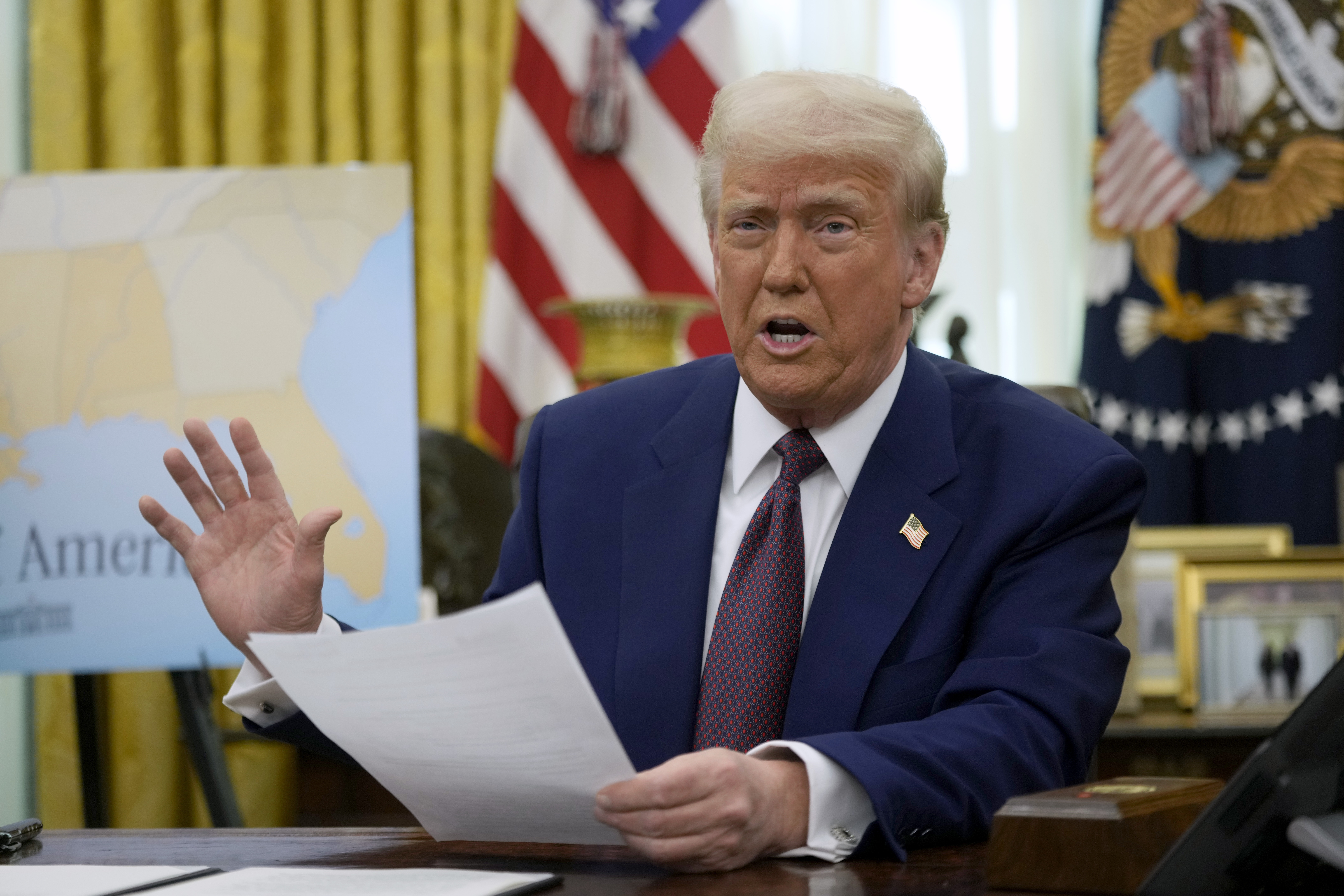 FILE - President Donald Trump speaks to reporters in the Oval Office of the White House, Feb. 13, 2025, in Washington. (AP Photo/Ben Curtis)