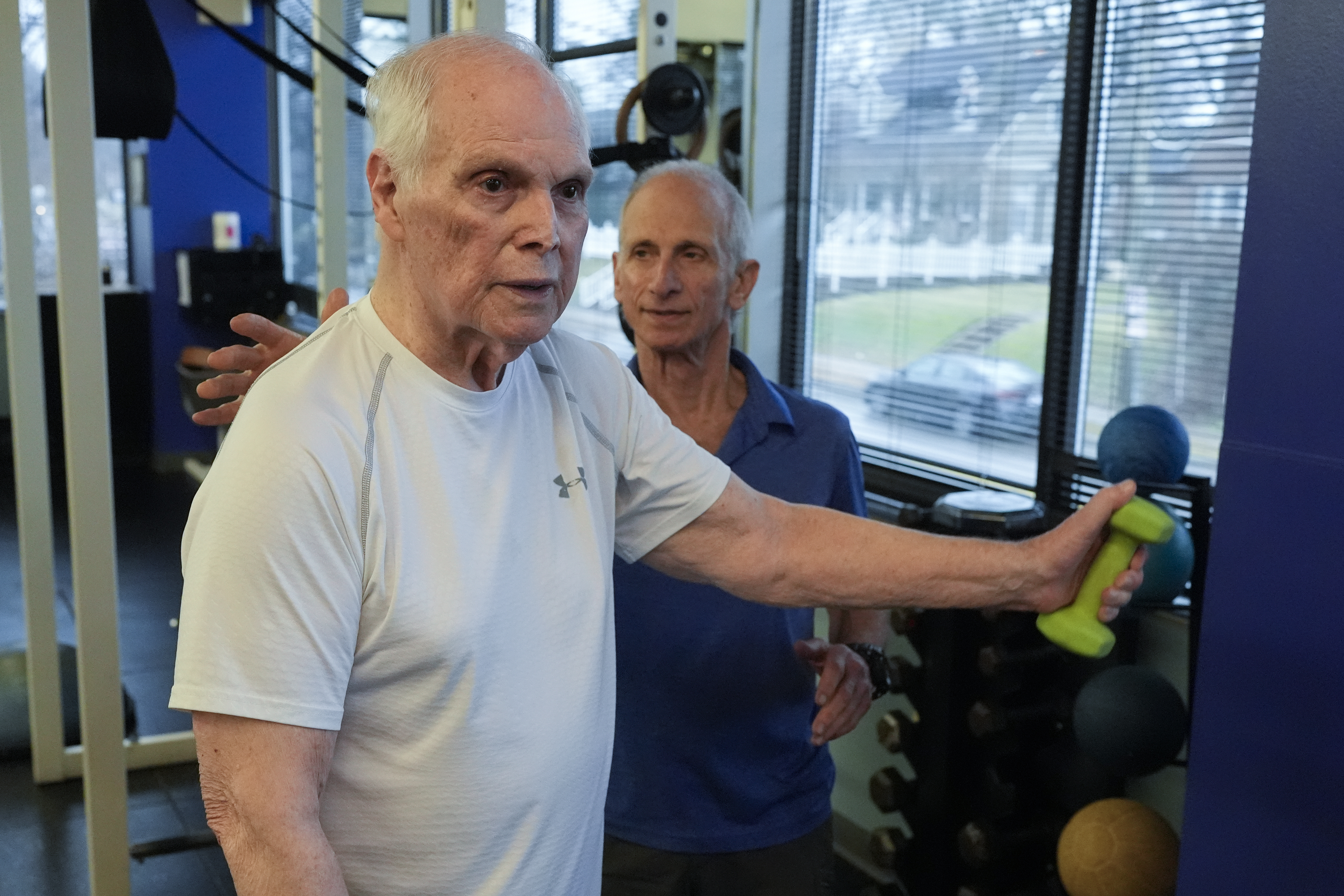 Dr. Grover Smith, left, works out with exercise scientist Dr. Irv Rubenstein, right, at STEPS Fitness, Wednesday, Feb. 12, 2025, in Nashville, Tenn. (AP Photo/George Walker IV)