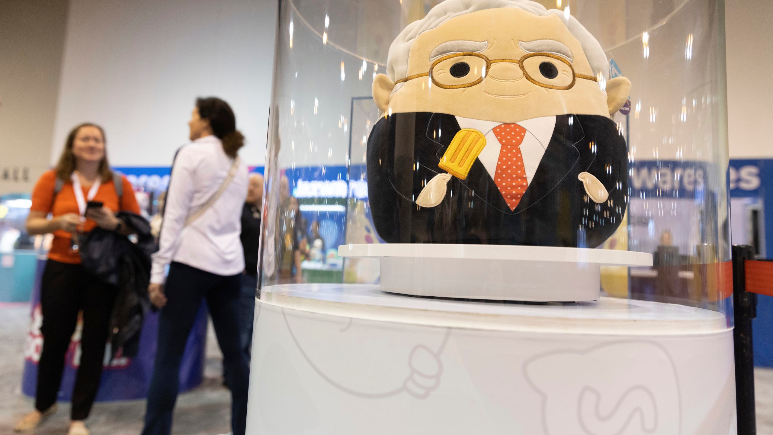 FILE - The Squishmallows booth sells toys modeled after Warren Buffett, pictured, and Charlie Munger in the exhibit hall for the Berkshire Hathaway annual meeting, Saturday, May 6, 2023, in Omaha, Neb. (AP Photo/Rebecca S. Gratz, File)