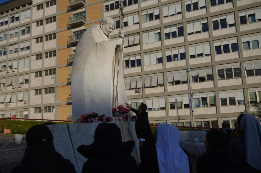 Nuns pray for Pope Francis in front of the Agostino Gemelli Polyclinic, in Rome, Saturday, Feb. 22, 2025, where the Pontiff has been hospitalized since Friday, Feb. 14. (AP Photo/Alessandra Tarantino)