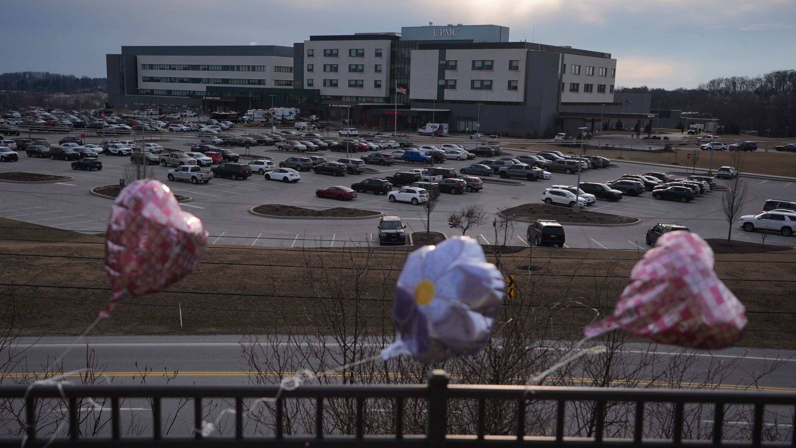 Balloons are placed in front of UPMC Memorial Hospital after a deadly shooting in York, Pa. on Saturday, Feb. 22, 2025. (AP Photo/Matt Rourke)