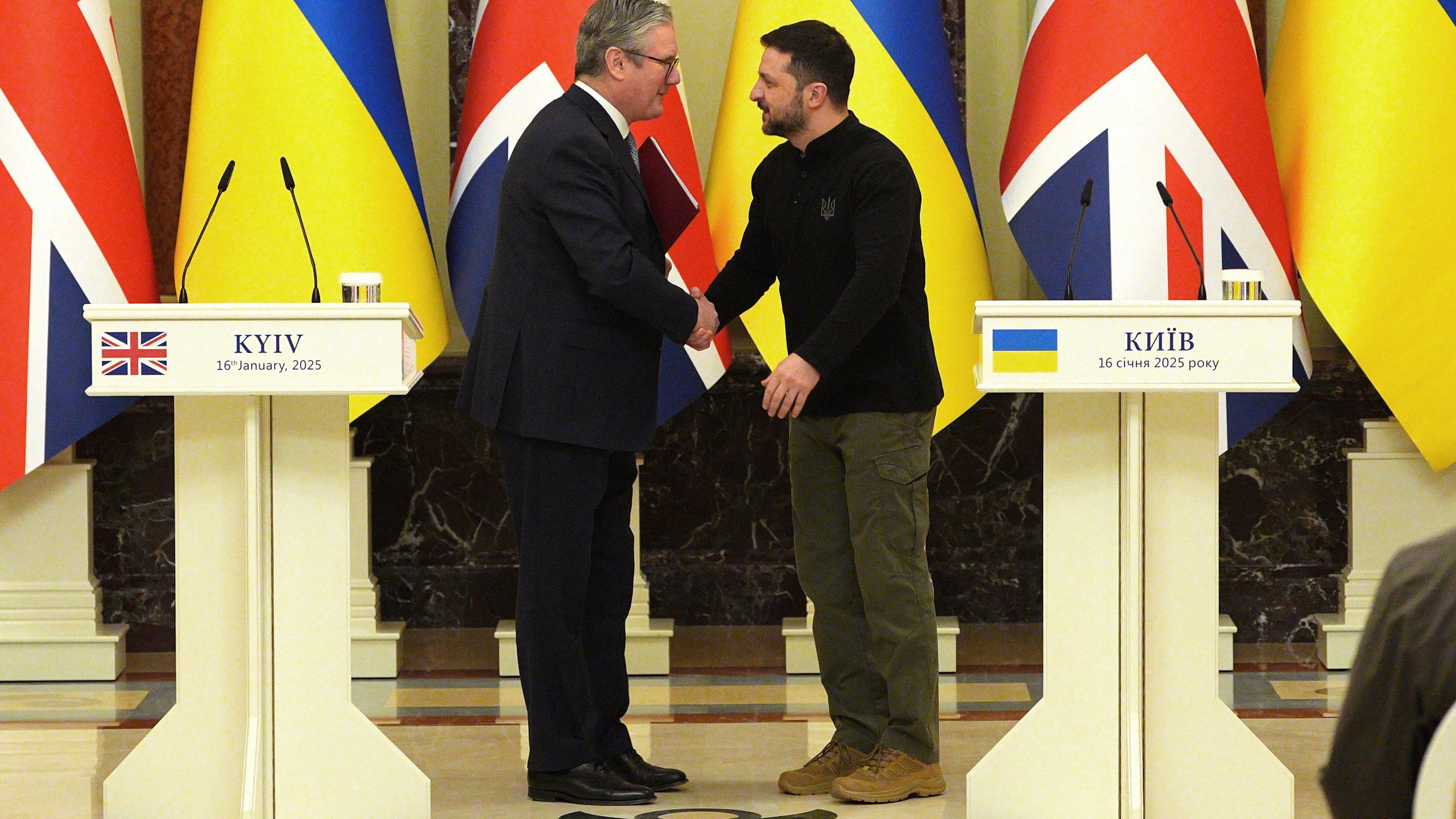 FILE - British Prime Minister Keir Starmer and Ukrainian President Volodymyr Zelensky, right, shake hands ahead of their bilateral talks at Mariinskyi Palace in Kyiv, Ukraine, Thursday, Jan. 16, 2025. (Carl Court, Pool Photo via AP, File)