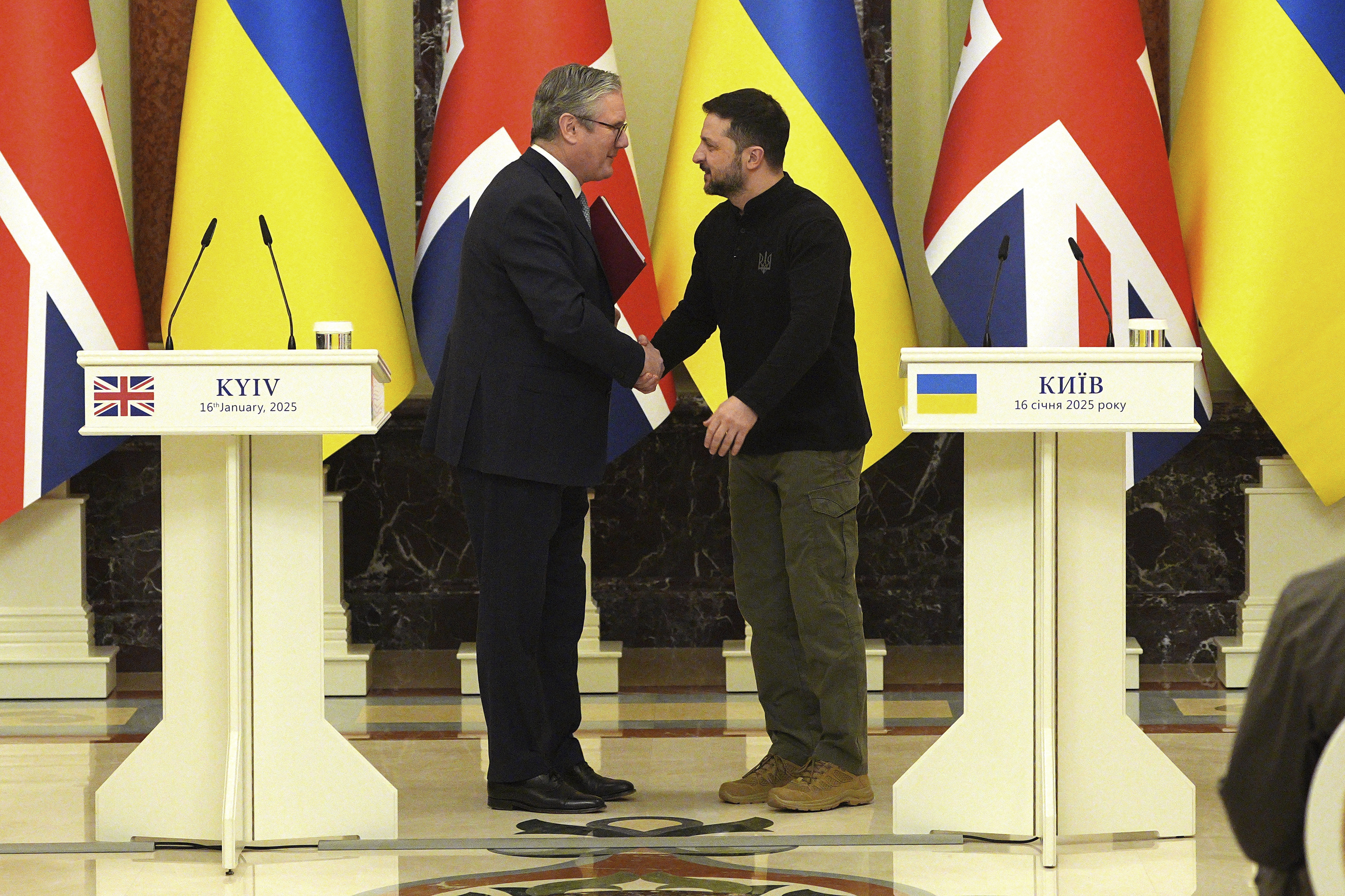 FILE - British Prime Minister Keir Starmer and Ukrainian President Volodymyr Zelensky, right, shake hands ahead of their bilateral talks at Mariinskyi Palace in Kyiv, Ukraine, Thursday, Jan. 16, 2025. (Carl Court, Pool Photo via AP, File)