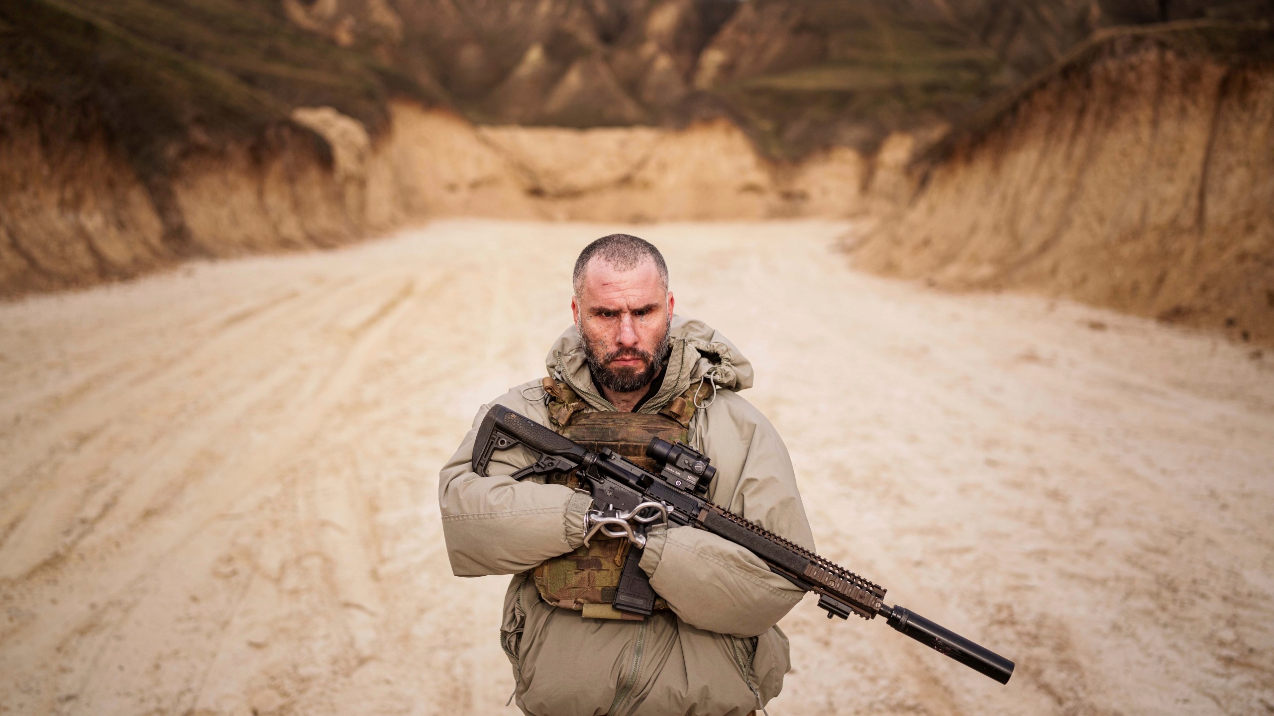 Andrii Rubliuk, a senior sergeant with a Ukrainian intelligence unit who lost both arms and a leg in combat, holds a rifle during military training near Kyiv, Ukraine, on Feb. 14, 2025. (AP Photo/Evgeniy Maloletka)