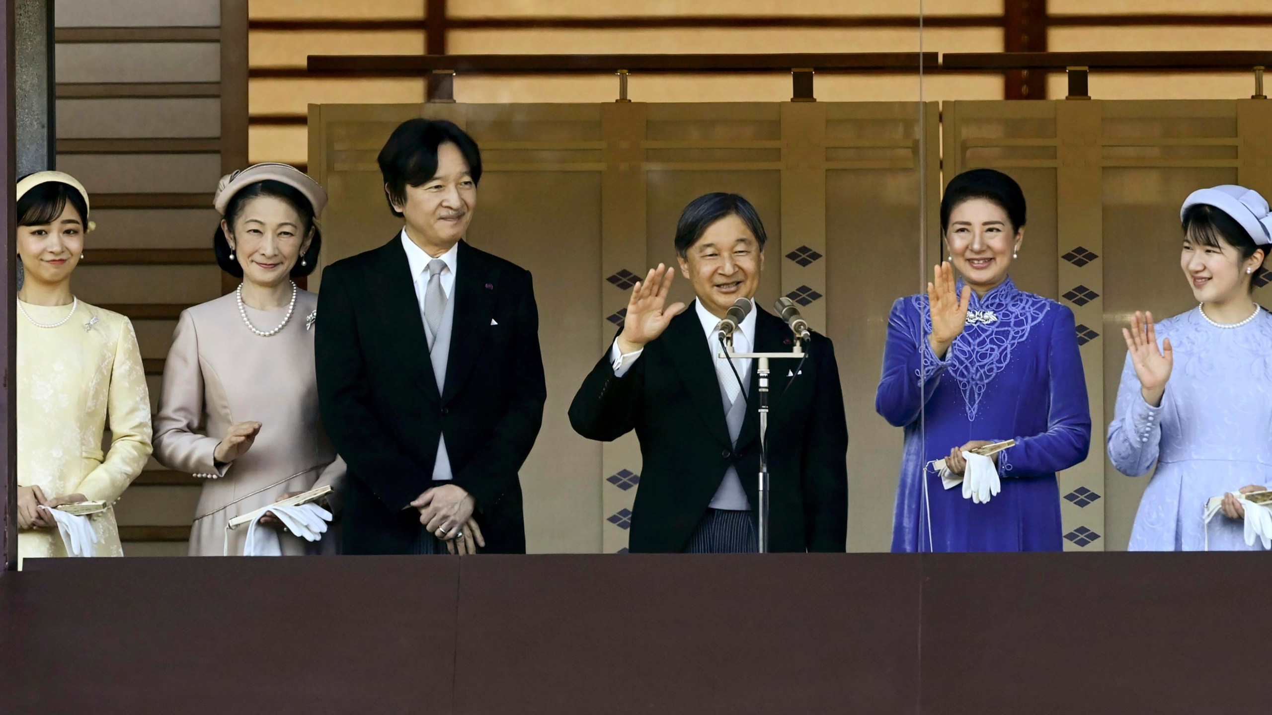 Japanese Emperor Naruhito, third right, accompanied by Empress Masako, second right, their daughter Princess Aiko, right, Crown Prince Akishino, third left, Crown Princess Kiko, second left, and Princess Kako, left, waves to well-wishers from the balcony of the Imperial Palace in Tokyo on the emperor's 65th birthday, Sunday, Feb. 23, 2025. (Kyodo News via AP)