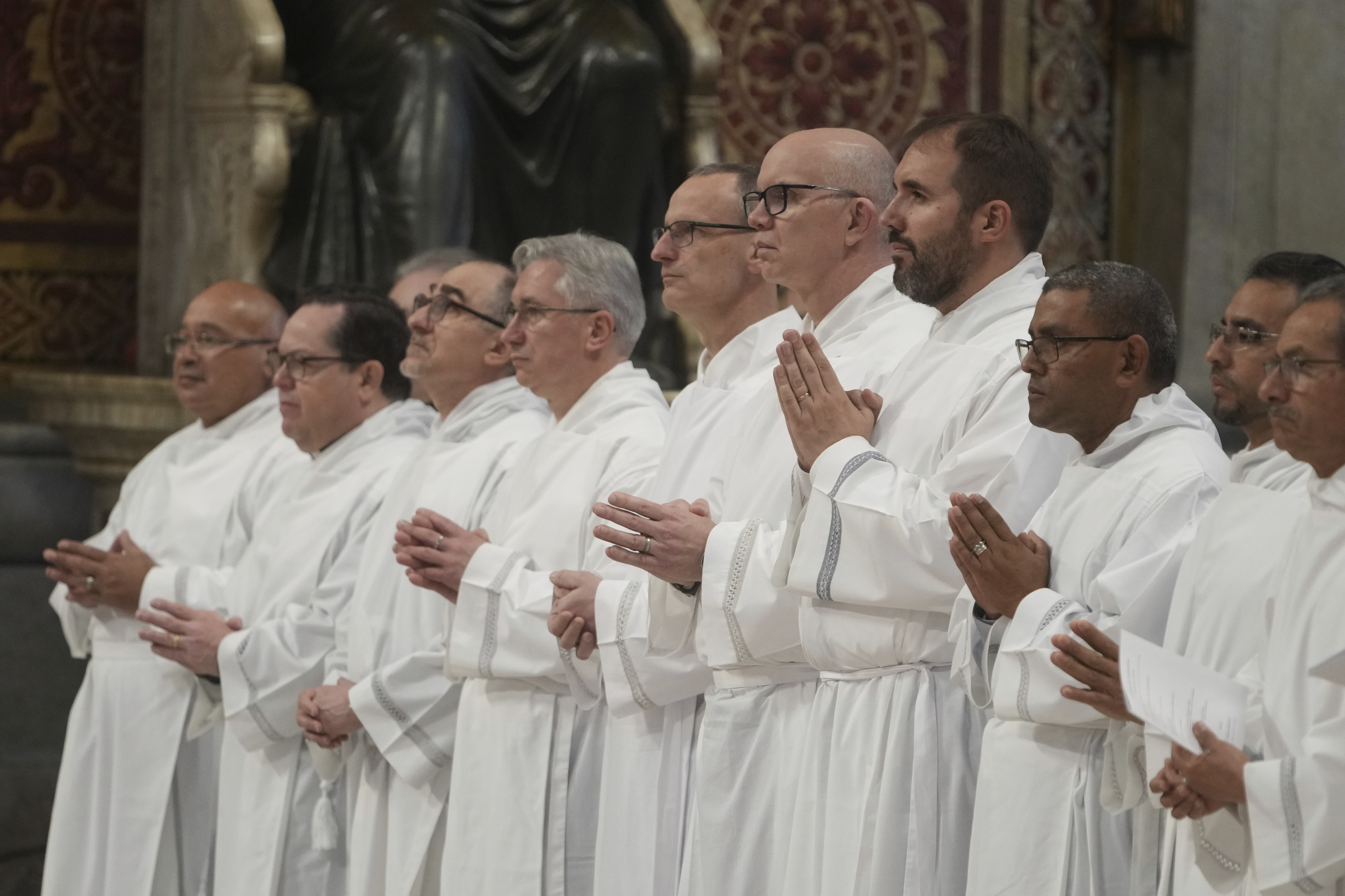 Deacons take part in a mass for their jubilee in St. Peter's Basilica at The Vatican, Sunday, Feb. 23, 2025, that was supposed to be presided over by Pope Francis who was admitted over a week ago at Rome's Agostino Gemelli Polyclinic and is in critical condition. (AP Photo/Alessandra Tarantino)