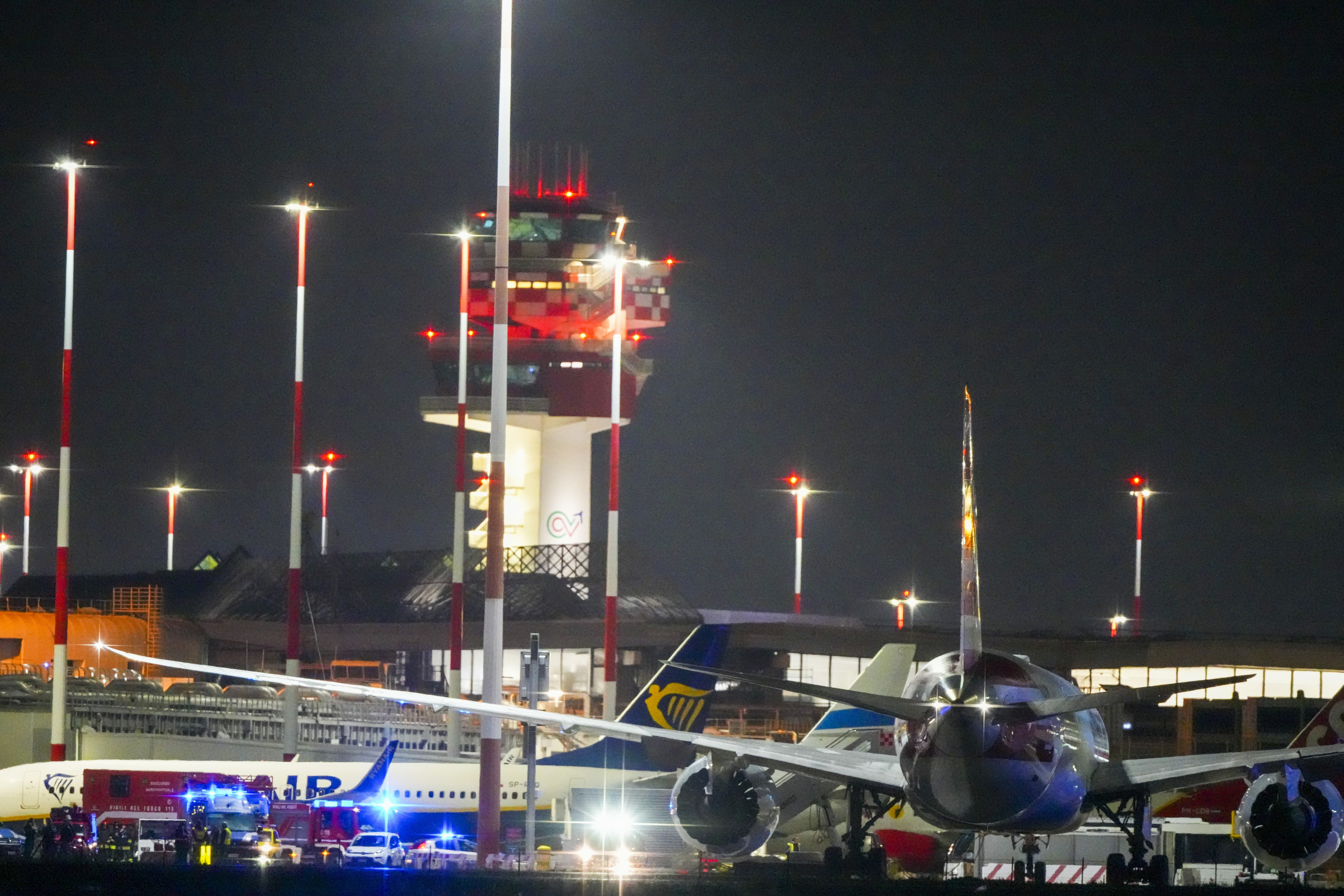 American Airlines flight AA292 en route from New York to New Delhi that turned around over the Caspian Sea Sunday, Feb. 23, 2025, sits on the tamarack of Rome's Leonardo da Vinci International airport. (AP Photo/Kirsty Wigglesworth)