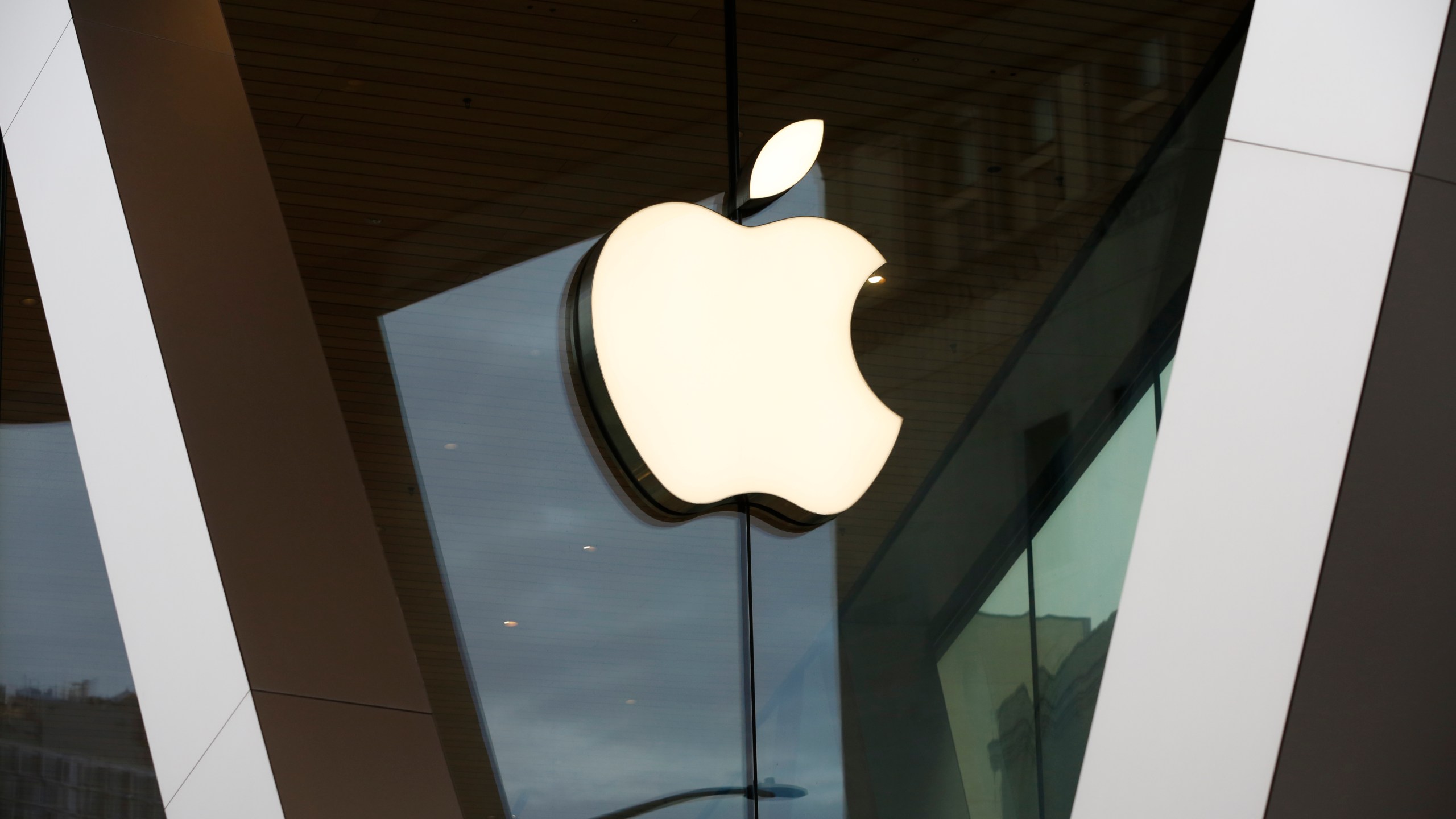 FILE - An Apple logo adorns the facade of the downtown Brooklyn Apple store on March 14, 2020, in New York. (AP Photo/Kathy Willens, File)