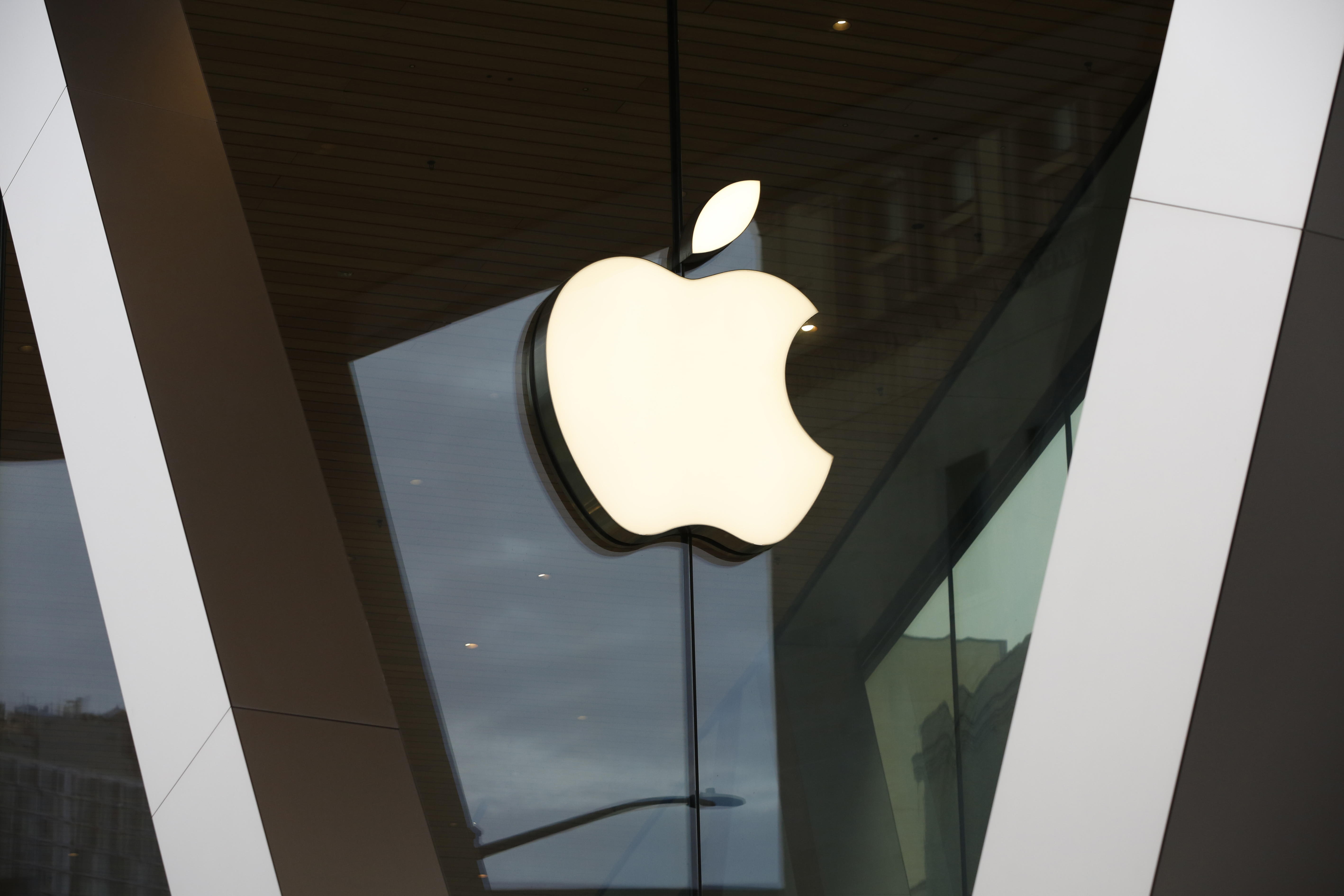 FILE - An Apple logo adorns the facade of the downtown Brooklyn Apple store on March 14, 2020, in New York. (AP Photo/Kathy Willens, File)