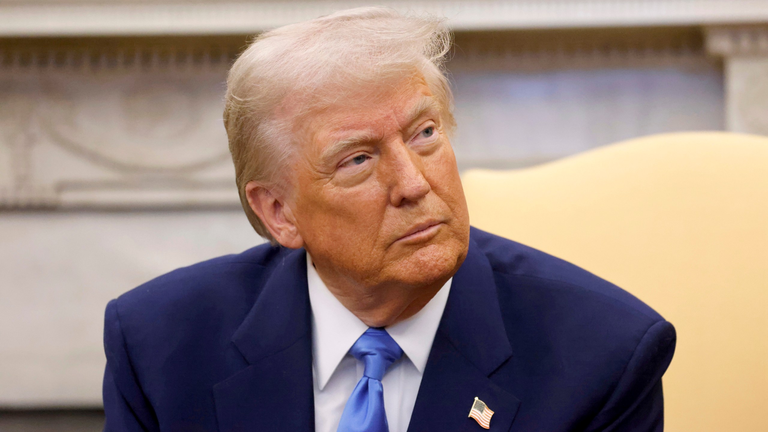 President Donald Trump listens during a meeting with France's President Emmanuel Macron in the Oval Office of the White House in Washington, Monday, Feb. 24, 2025. (Ludovic Marin/Pool via AP)