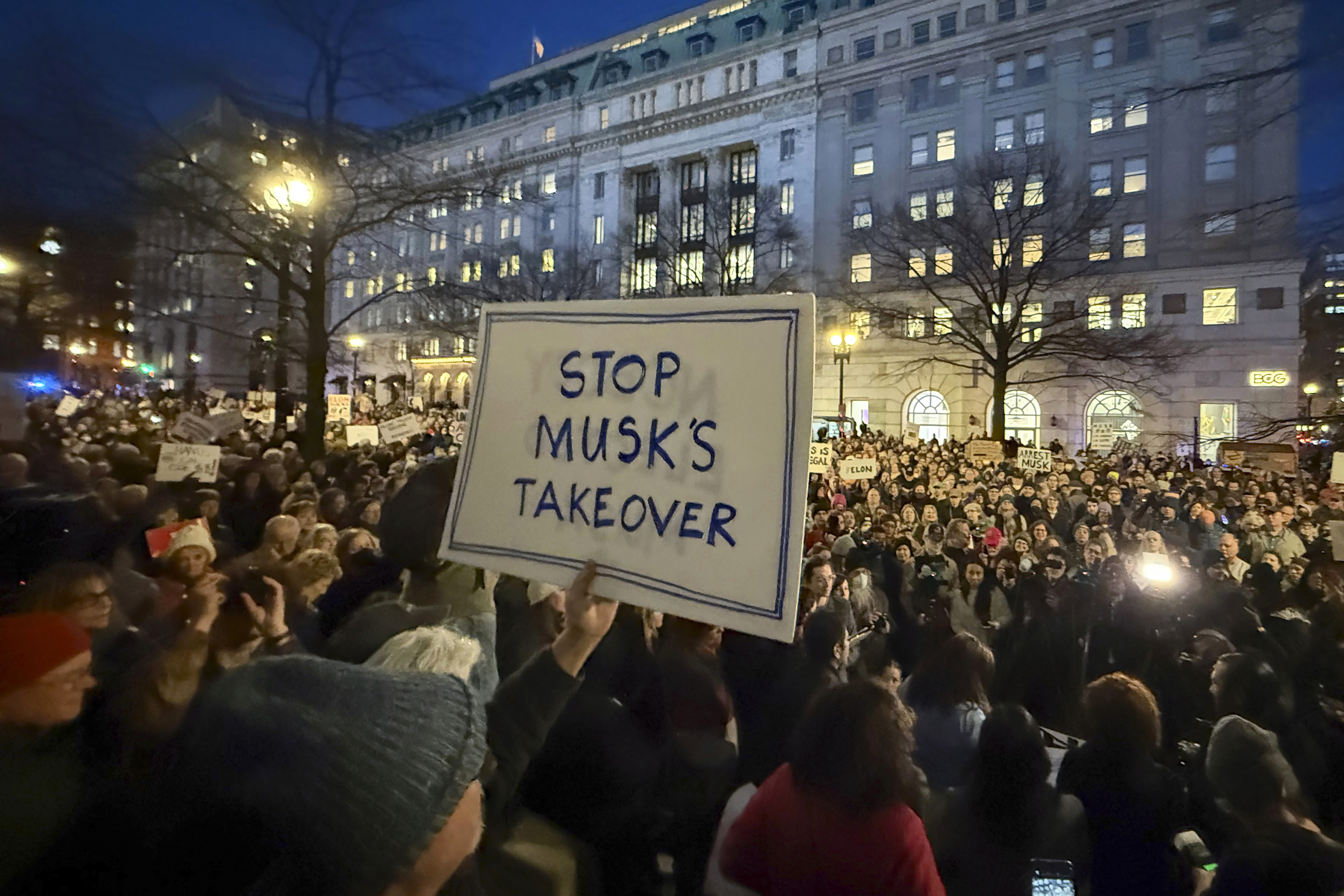 FILE - People protest during a rally outside the Treasury Department in Washington, Feb. 4, 2025. (AP Photo/Jose Luis Magana, File)