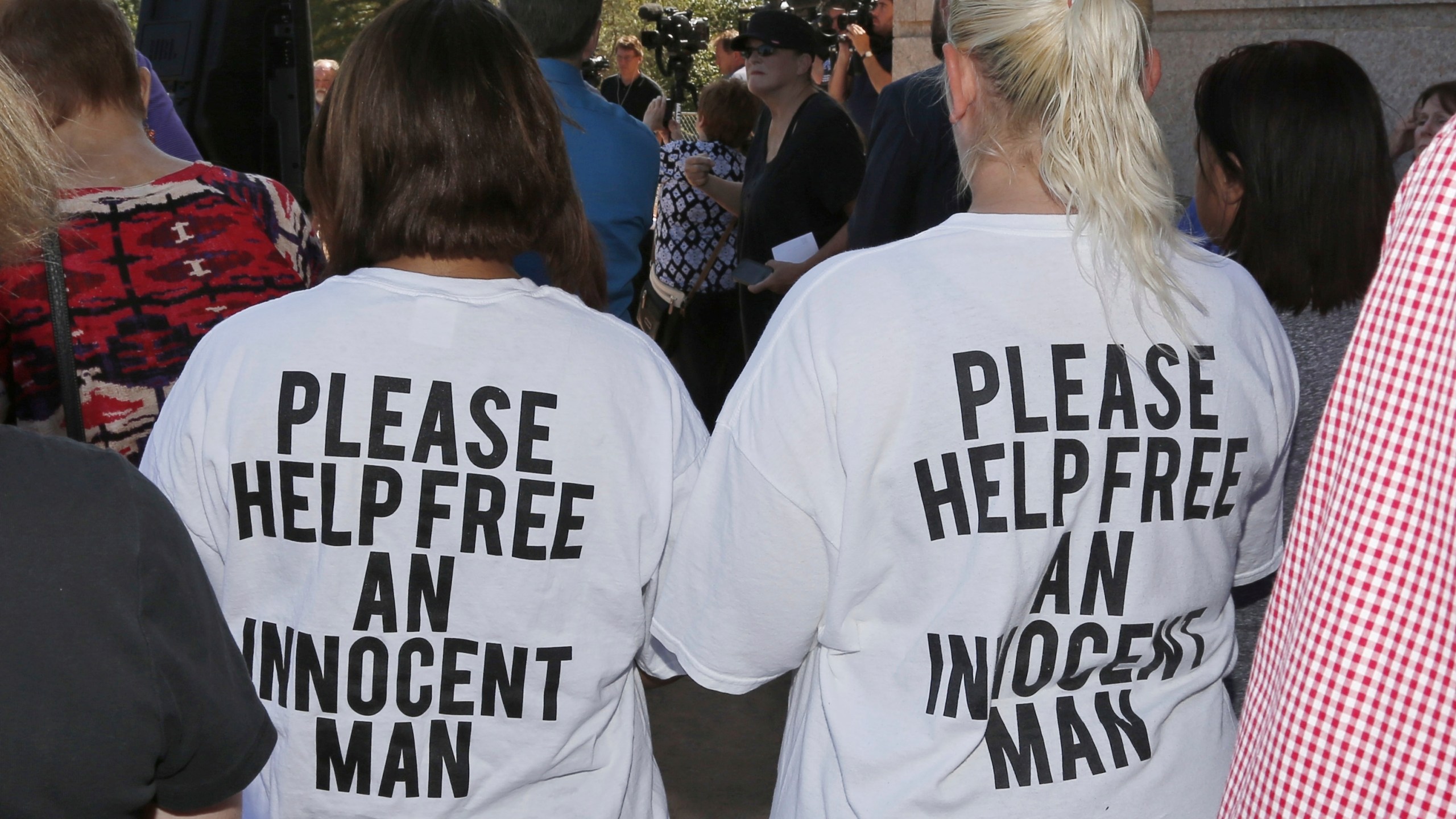 Ericka Glossip-Hodge, left, daughter of Richard Glossip, and Billie Jo Ogden Boyiddle, right, Richard Glossip's sister, listen during a rally to stop the execution of Richard Glossip, in Oklahoma City, Tuesday, Sept. 15, 2015. (AP Photo/Sue Ogrocki, File)