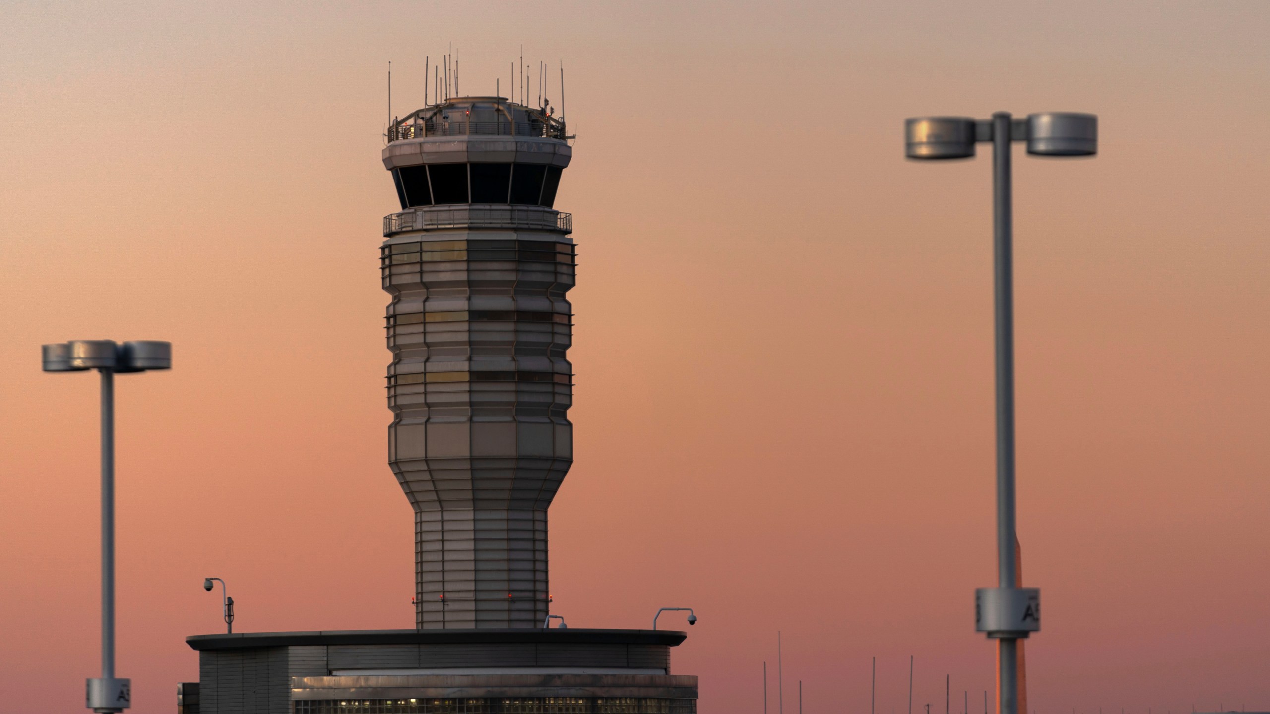 FILE - The air traffic control tower at Ronald Reagan Washington National Airport is seen at sunset, Saturday, Feb. 1, 2025, in Arlington, Va.. (AP Photo/Jose Luis Magana, file)