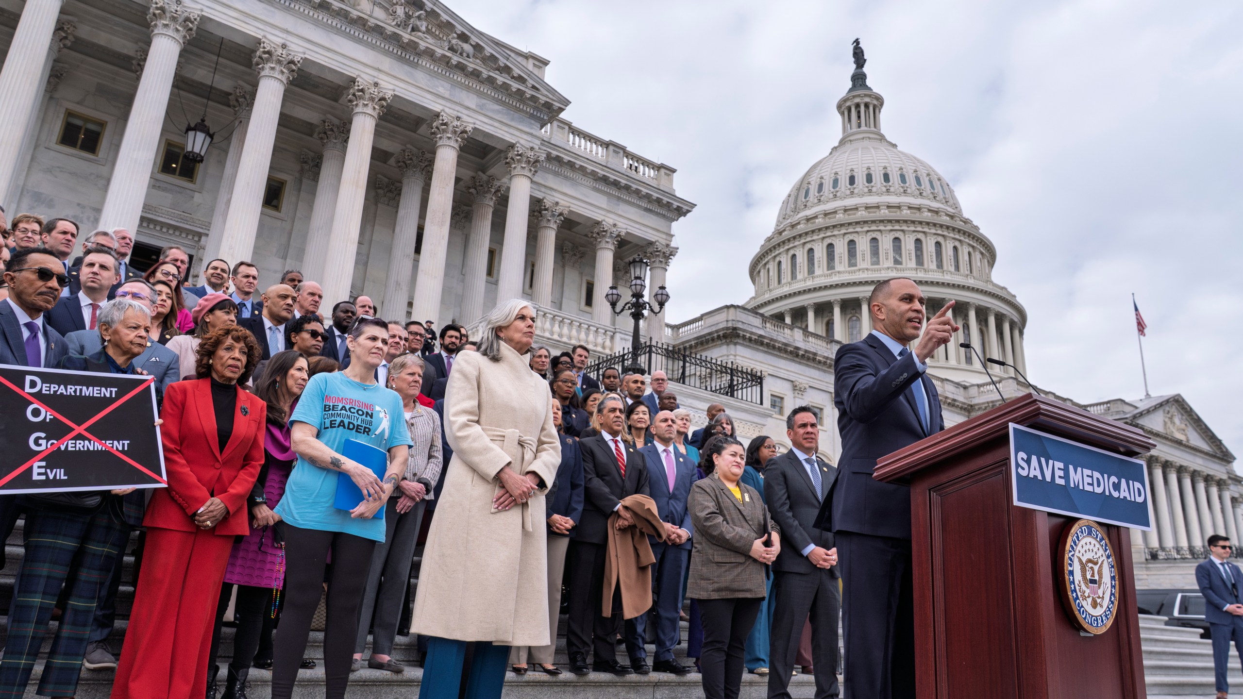 House Minority Leader Hakeem Jeffries, D-N.Y., right, joined at center left by Rep. Katherine Clark, D-Mass., the House minority whip, speaks against the Republican budget plan, on the House steps at the Capitol in Washington, Tuesday, Feb. 25, 2025. (AP Photo/J. Scott Applewhite)