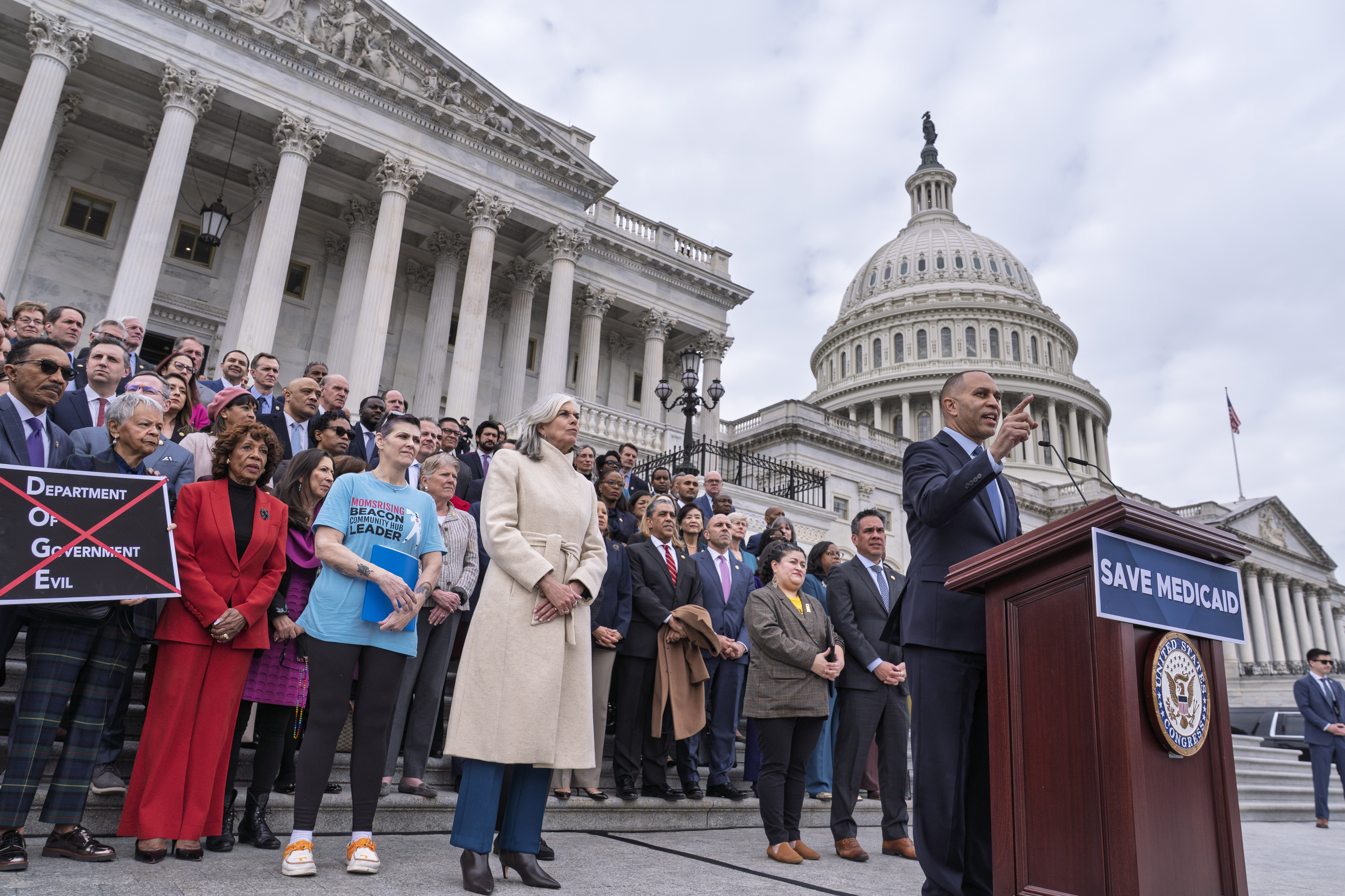 House Minority Leader Hakeem Jeffries, D-N.Y., right, joined at center left by Rep. Katherine Clark, D-Mass., the House minority whip, speaks against the Republican budget plan, on the House steps at the Capitol in Washington, Tuesday, Feb. 25, 2025. (AP Photo/J. Scott Applewhite)