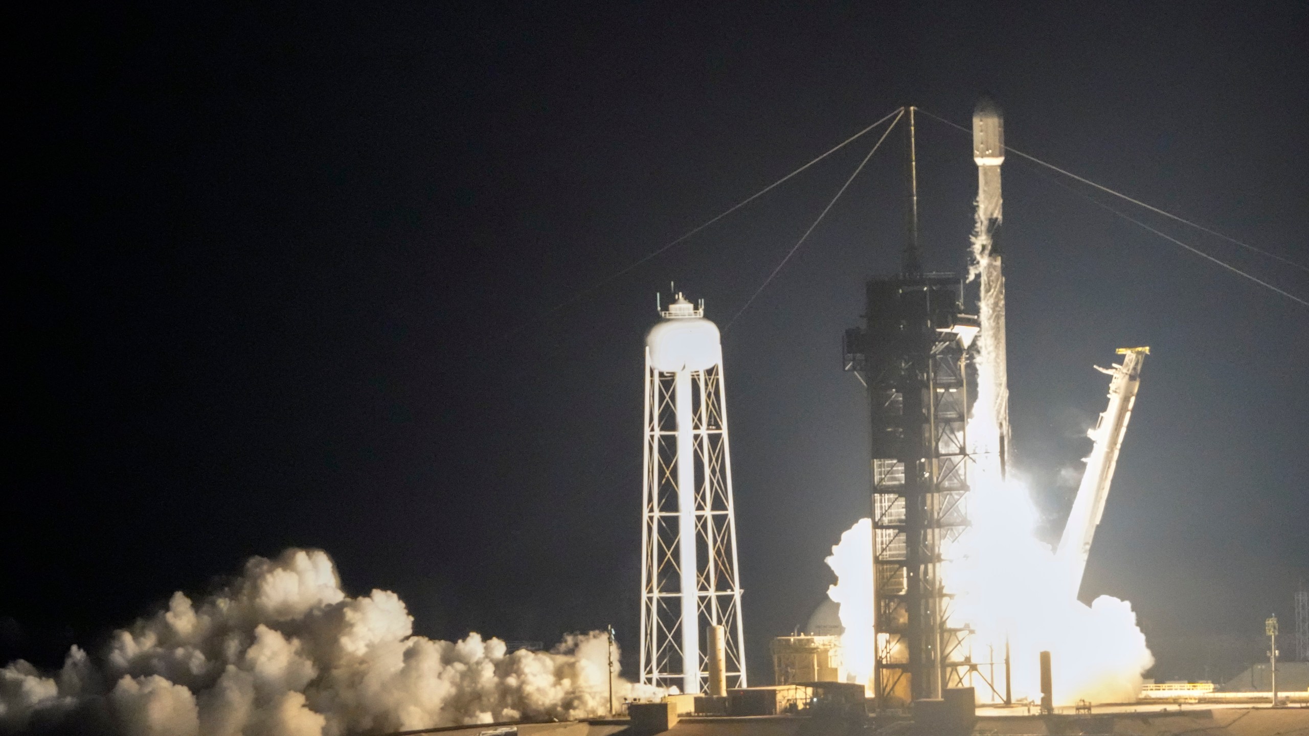 A SpaceX Falcon 9 rocket with Intuitive Machines' second lunar lander lifts off from pad 39A at the Kennedy Space Center in Cape Canaveral, Fla., Wednesday, Feb. 26, 2025. (AP Photo/John Raoux)