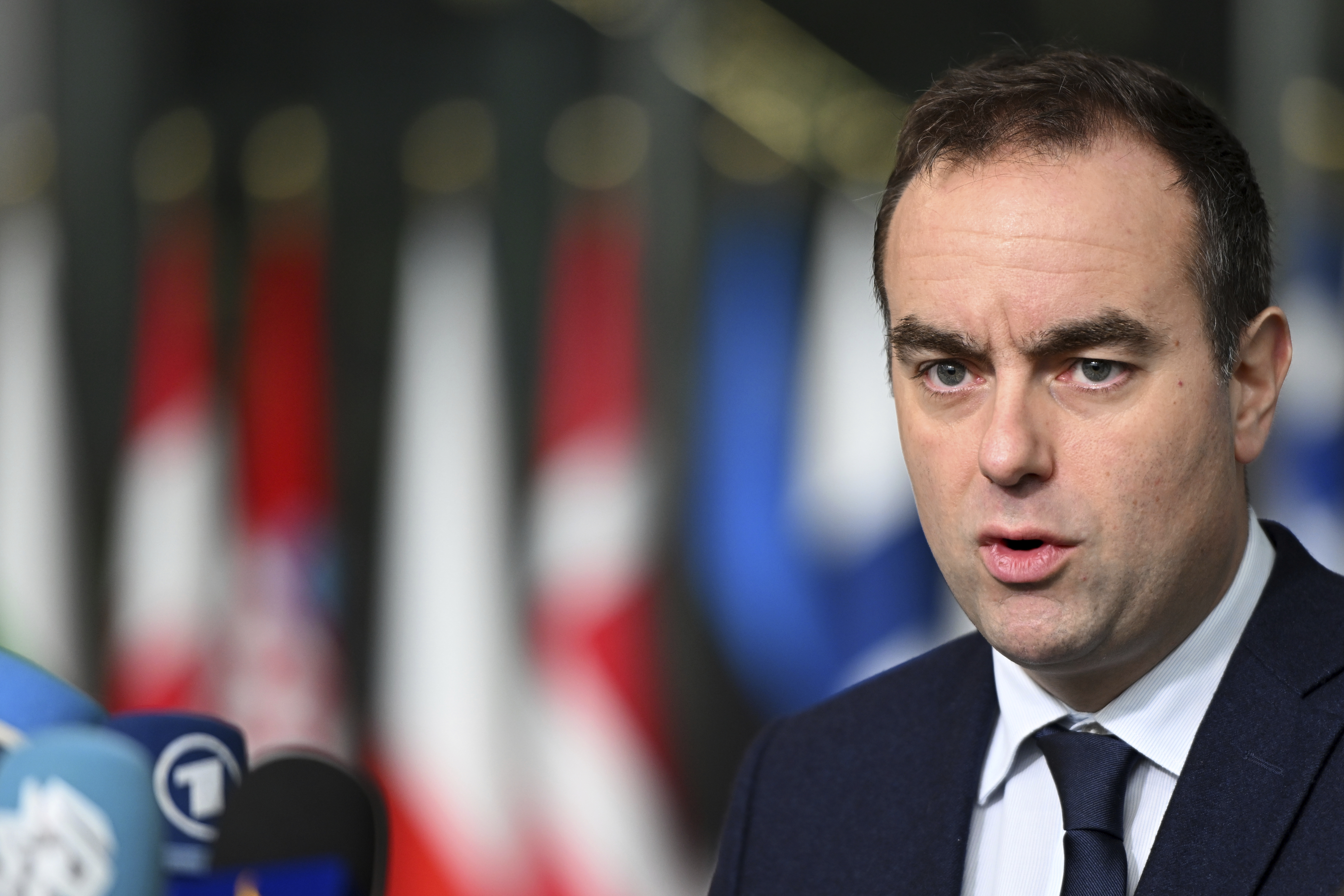 French Defense Minister Sebastien Lecornu speaks with the media as he arrives for a meeting of NATO defense ministers at NATO headquarters in Brussels, Thursday, Feb. 13, 2025. (AP Photo/Harry Nakos)