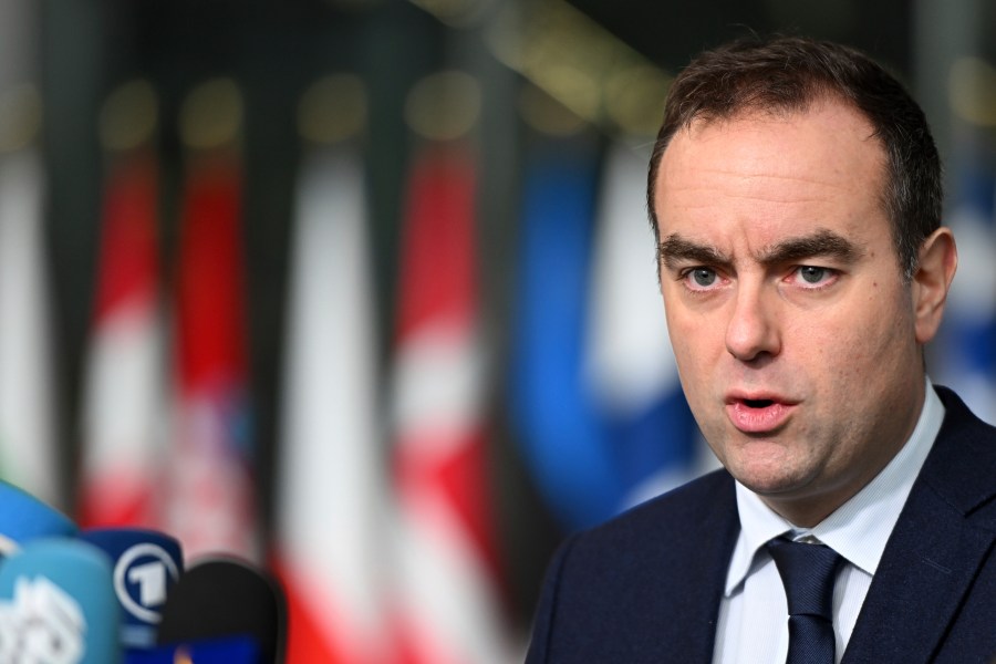 French Defense Minister Sebastien Lecornu speaks with the media as he arrives for a meeting of NATO defense ministers at NATO headquarters in Brussels, Thursday, Feb. 13, 2025. (AP Photo/Harry Nakos)