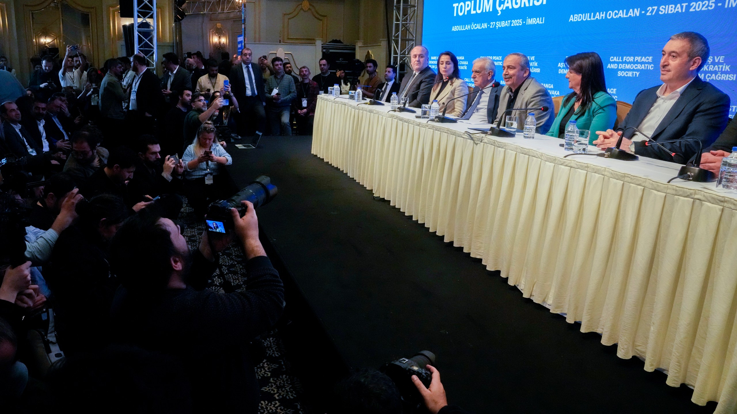 Pro-Kurdish Peoples' Equality and Democracy Party, or DEM, delegation members release an statement from the jailed leader of the rebel Kurdistan Workers' Party, or PKK, Abdullah Ocalan, in Istanbul, Turkey, Thursday, Feb. 27, 2025. (AP Photo/Khalil Hamra)