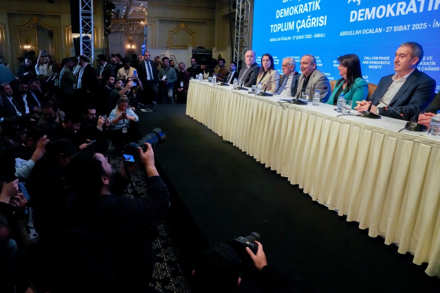 Pro-Kurdish Peoples' Equality and Democracy Party, or DEM, delegation members release an statement from the jailed leader of the rebel Kurdistan Workers' Party, or PKK, Abdullah Ocalan, in Istanbul, Turkey, Thursday, Feb. 27, 2025. (AP Photo/Khalil Hamra)