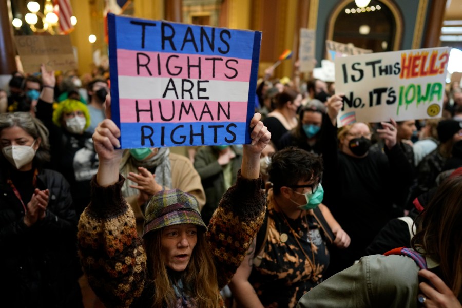 Protesters fill the Iowa state Capitol to denounce a bill that would strip the state civil rights code of protections based on gender identity, Thursday, Feb. 27, 2025, in Des Moines, Iowa. (AP Photo/Charlie Neibergall)