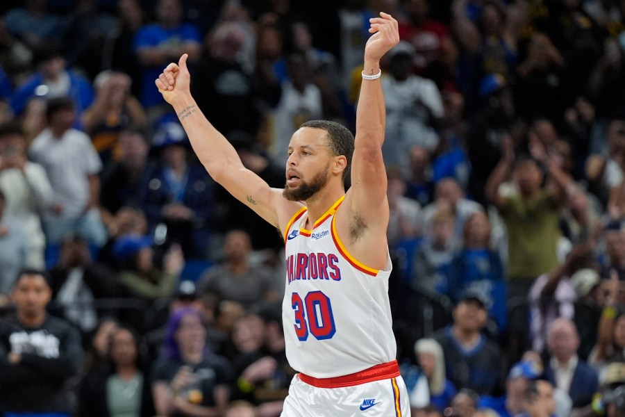 Golden State Warriors guard Stephen Curry (30) celebrates after making a 3-point shot against the Orlando Magic during the second half of an NBA basketball game, Thursday, Feb. 27, 2025, in Orlando, Fla. (AP Photo/John Raoux)