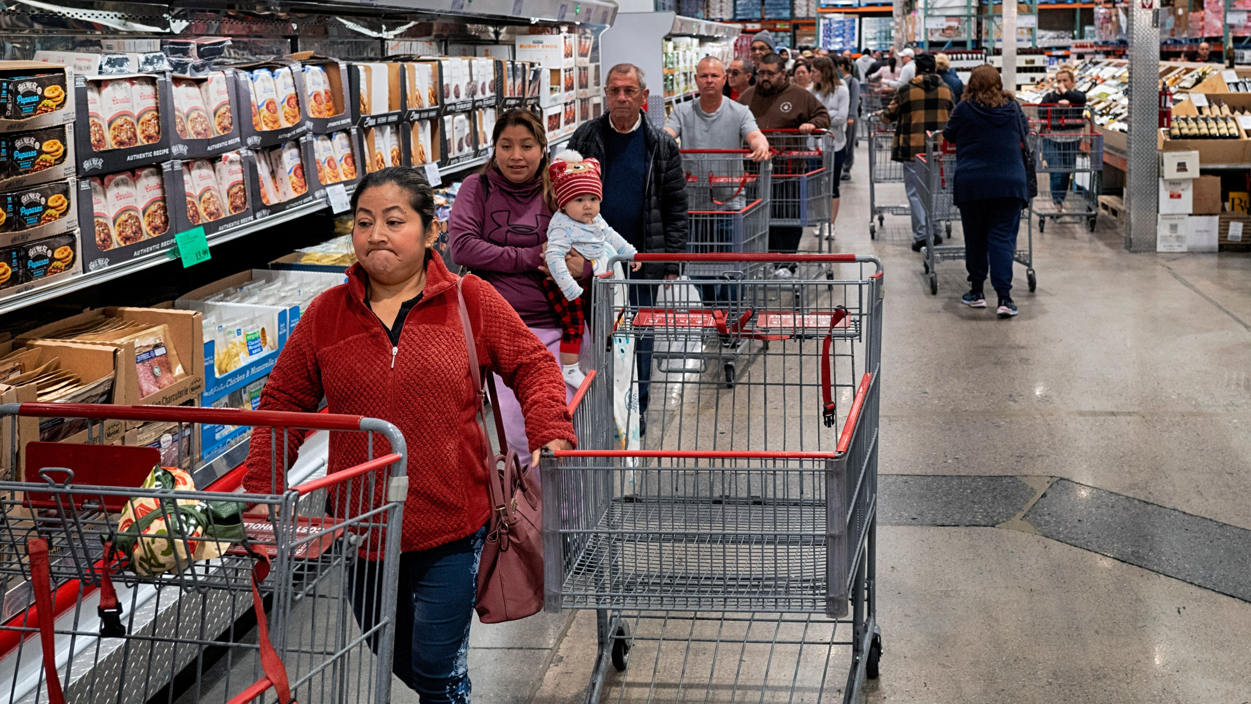 FILE - Customers wait in line for eggs at a Costco store in the Van Nuys section of Los Angeles on Wednesday, Feb. 19, 2025. (AP Photo/Richard Vogel, File)