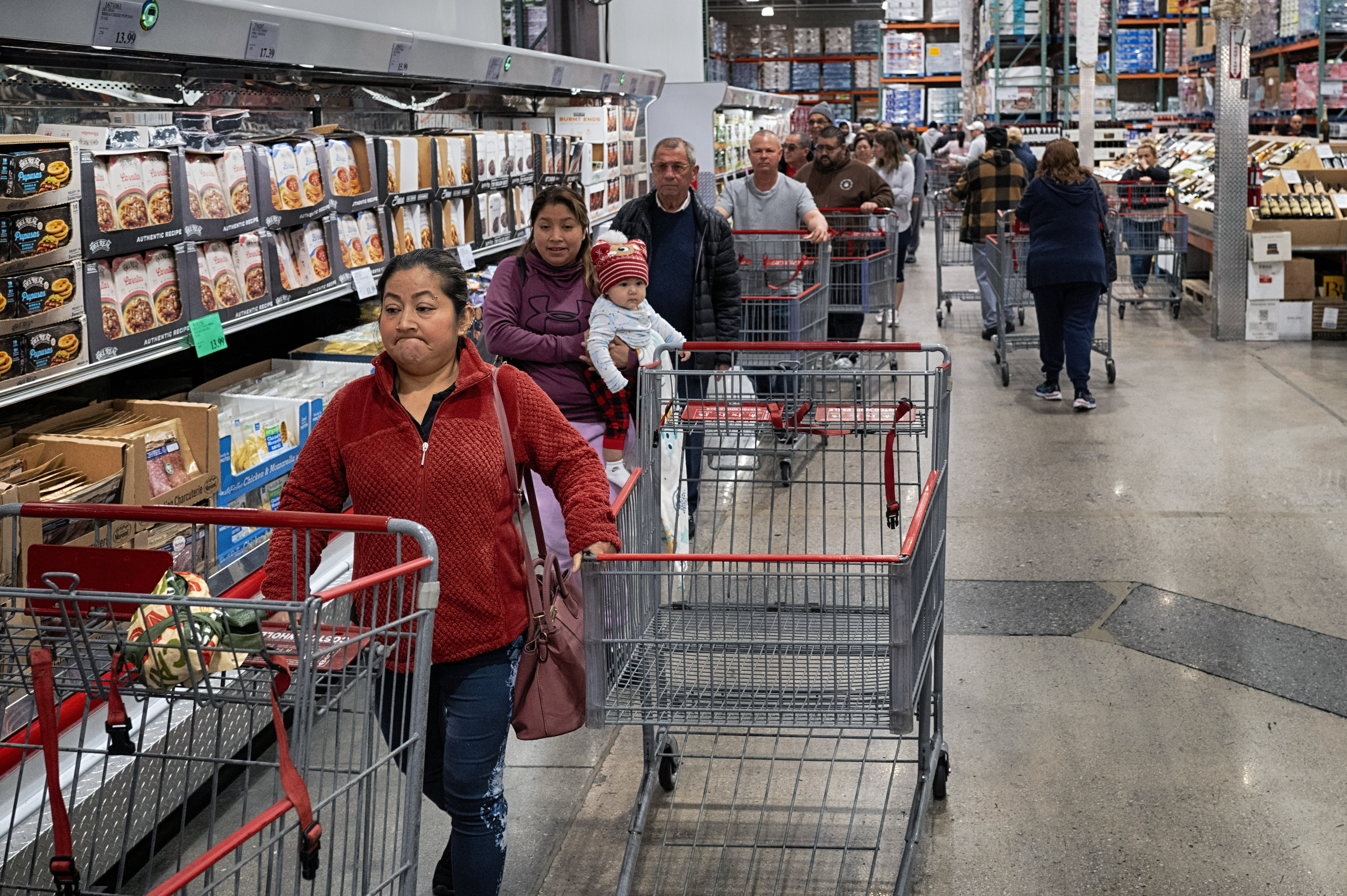 FILE - Customers wait in line for eggs at a Costco store in the Van Nuys section of Los Angeles on Wednesday, Feb. 19, 2025. (AP Photo/Richard Vogel, File)