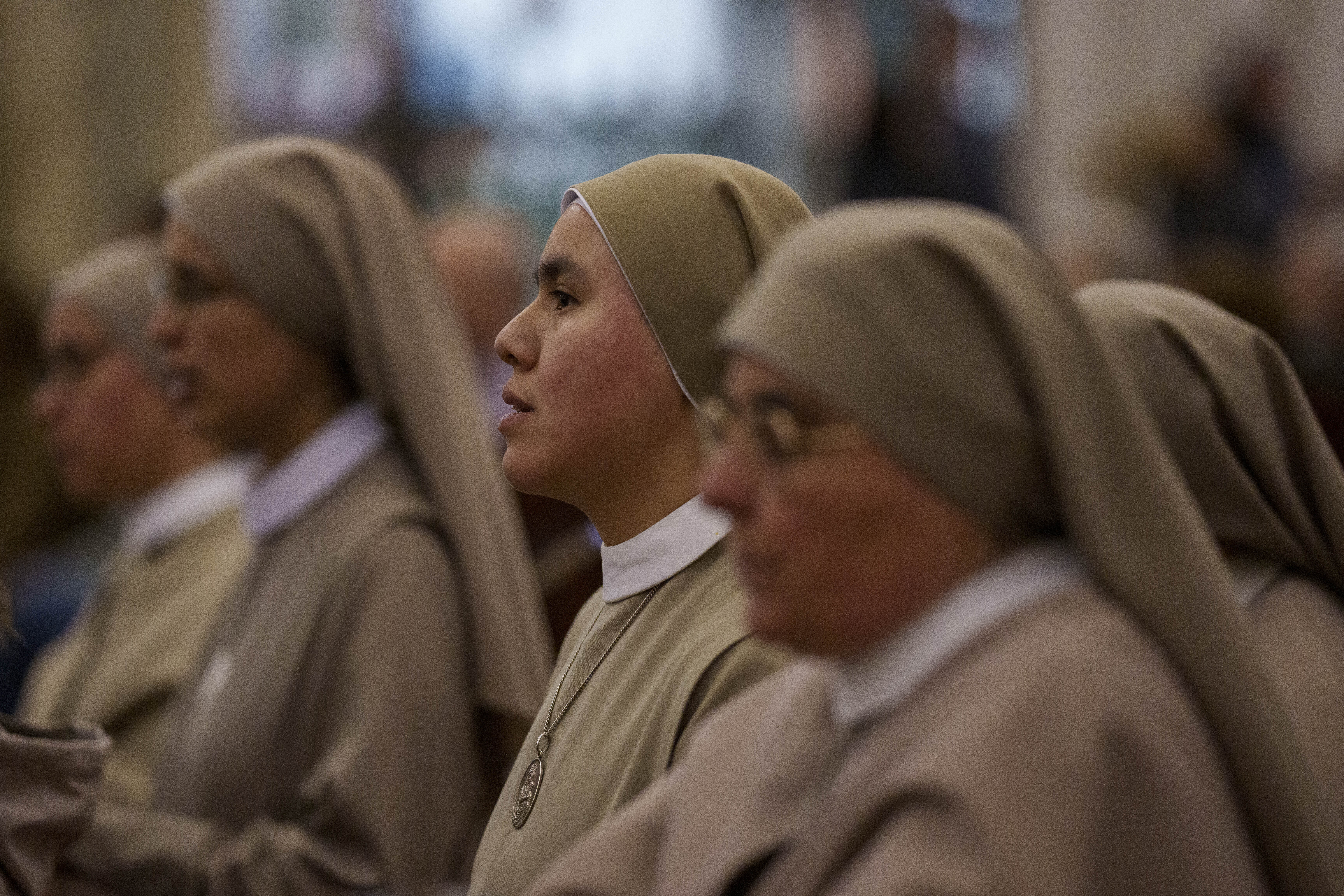 Nuns pray for Pope Francis at Almudena Cathedral in Madrid, Spain, on Thursday, Feb. 27, 2025. (AP Photo/Manu Fernandez)